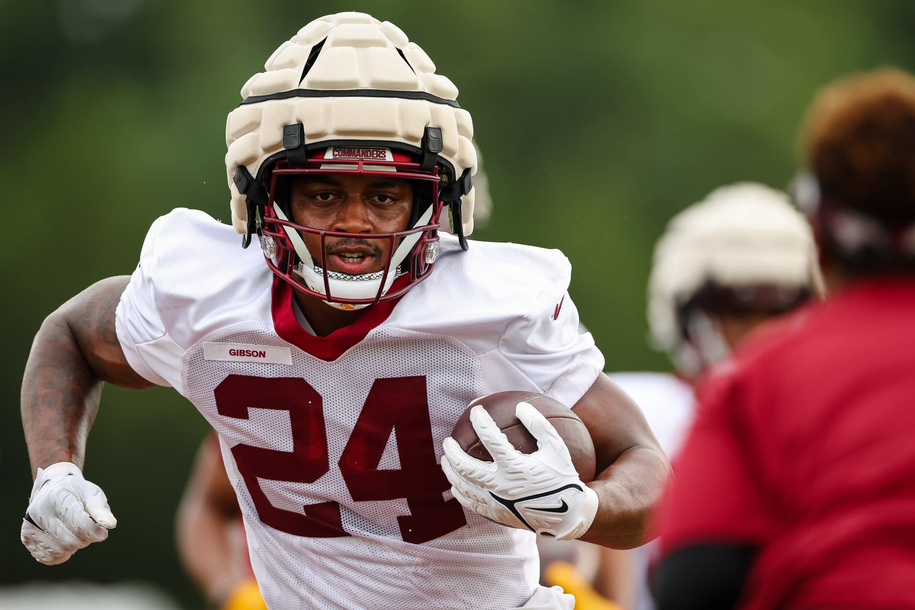 ASHBURN, VA - AUGUST 17: Antonio Gibson #24 of the Washington Commanders participates in a drill during training camp at INOVA Sports Performance Center on August 17, 2022 in Ashburn, Virginia. (Photo by Scott Taetsch/Getty Images)