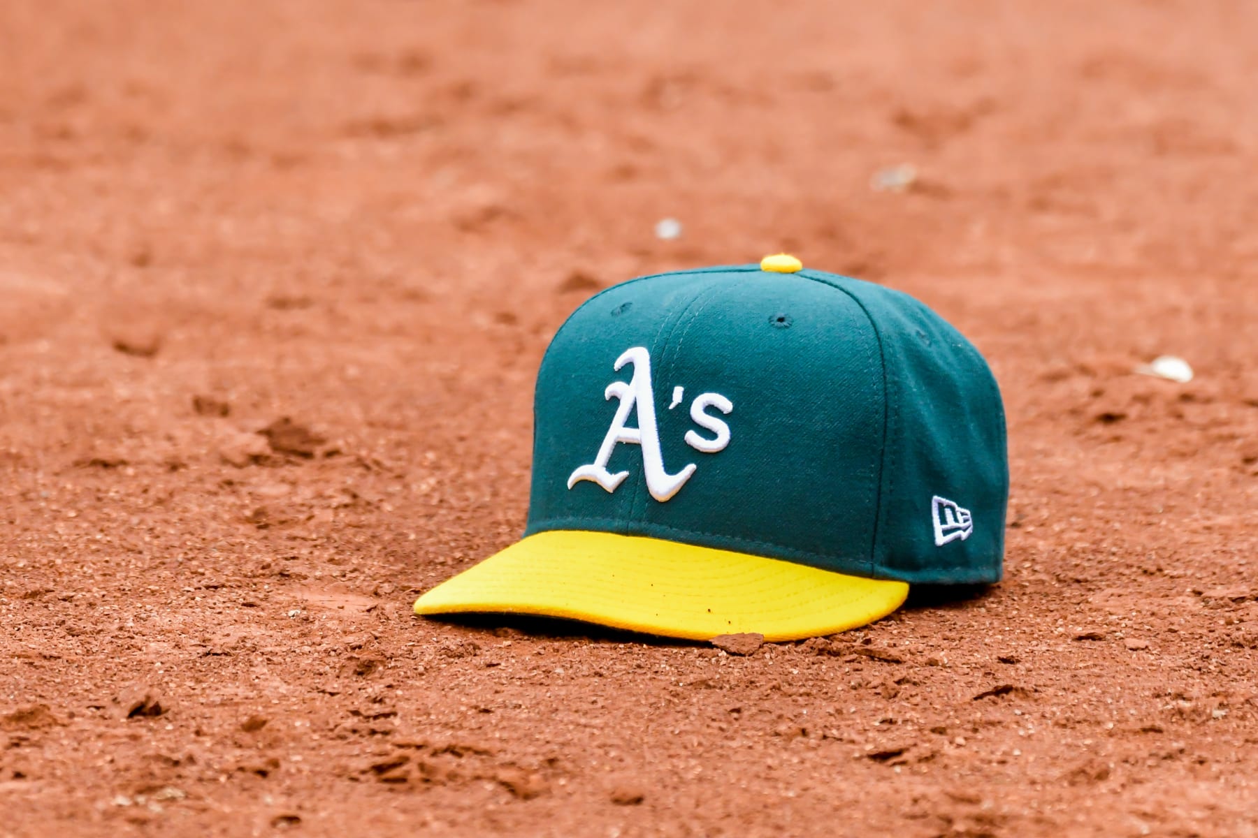 OAKLAND, CA - JULY 06: The A's dugout threw out a hat for Oakland Athletics second baseman Nick Allen (2) with his multiple field hat trick plays during the game between the Toronto Blue Jays and the Oakland Athletics on Wednesday, July 6, 2022 at the Oakland Coliseum in Oakland, California. (Photo by Douglas Stringer/Icon Sportswire via Getty Images)