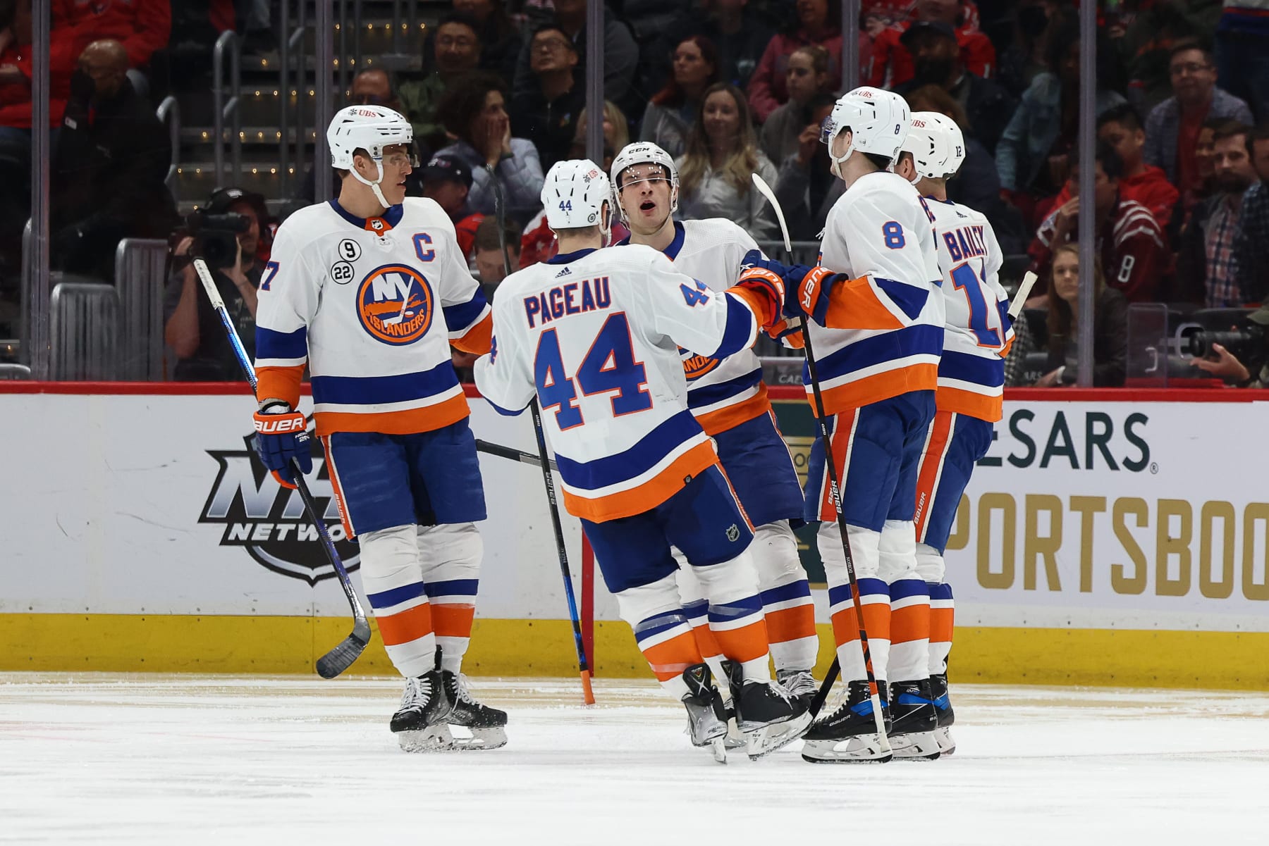WASHINGTON, DC - APRIL 26: The New York Islanders celebrate a goal during a game against the Washington Capitals at Capital One Arena on April 26, 2022 in Washington, D.C. (Photo by John McCreary/NHLI via Getty Images)