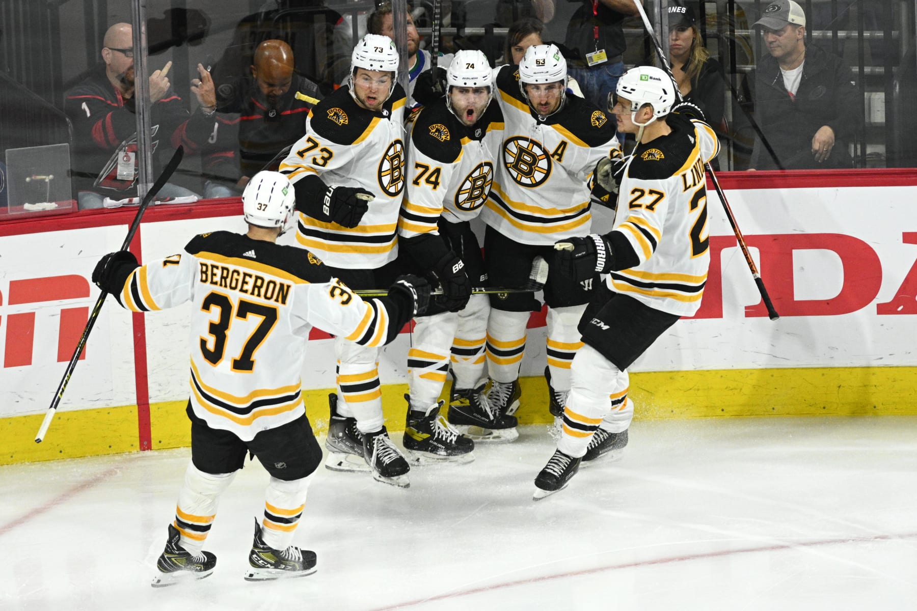 RALEIGH, NC - MAY 14: Members of the Boston Bruins celebrate scoring a goal during game 7 of the first round of the Stanley Cup Playoffs between the Boston Bruins and the Carolina Hurricanes on May 14, 2022 at PNC Arena in Raleigh, North Carolina. (Photo by Katherine Gawlik/Icon Sportswire via Getty Images)
