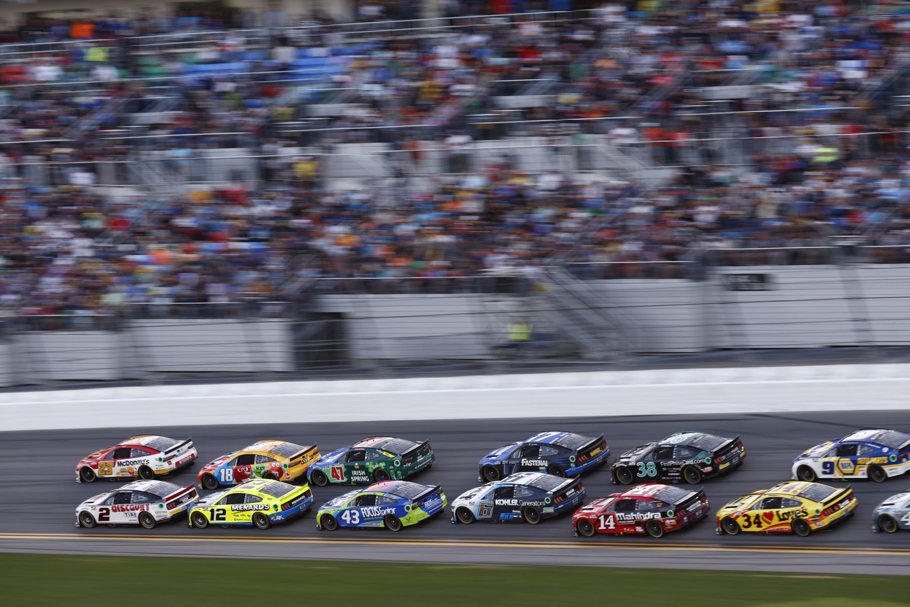 DAYTONA BEACH, FLORIDA - FEBRUARY 20: Bubba Wallace, driver of the #23 McDonald's Toyota, and Austin Cindric, driver of the #2 Discount Tire Ford, lead the field during the NASCAR Cup Series 64th Annual Daytona 500 at Daytona International Speedway on February 20, 2022 in Daytona Beach, Florida. (Photo by Jared C. Tilton/Getty Images)
