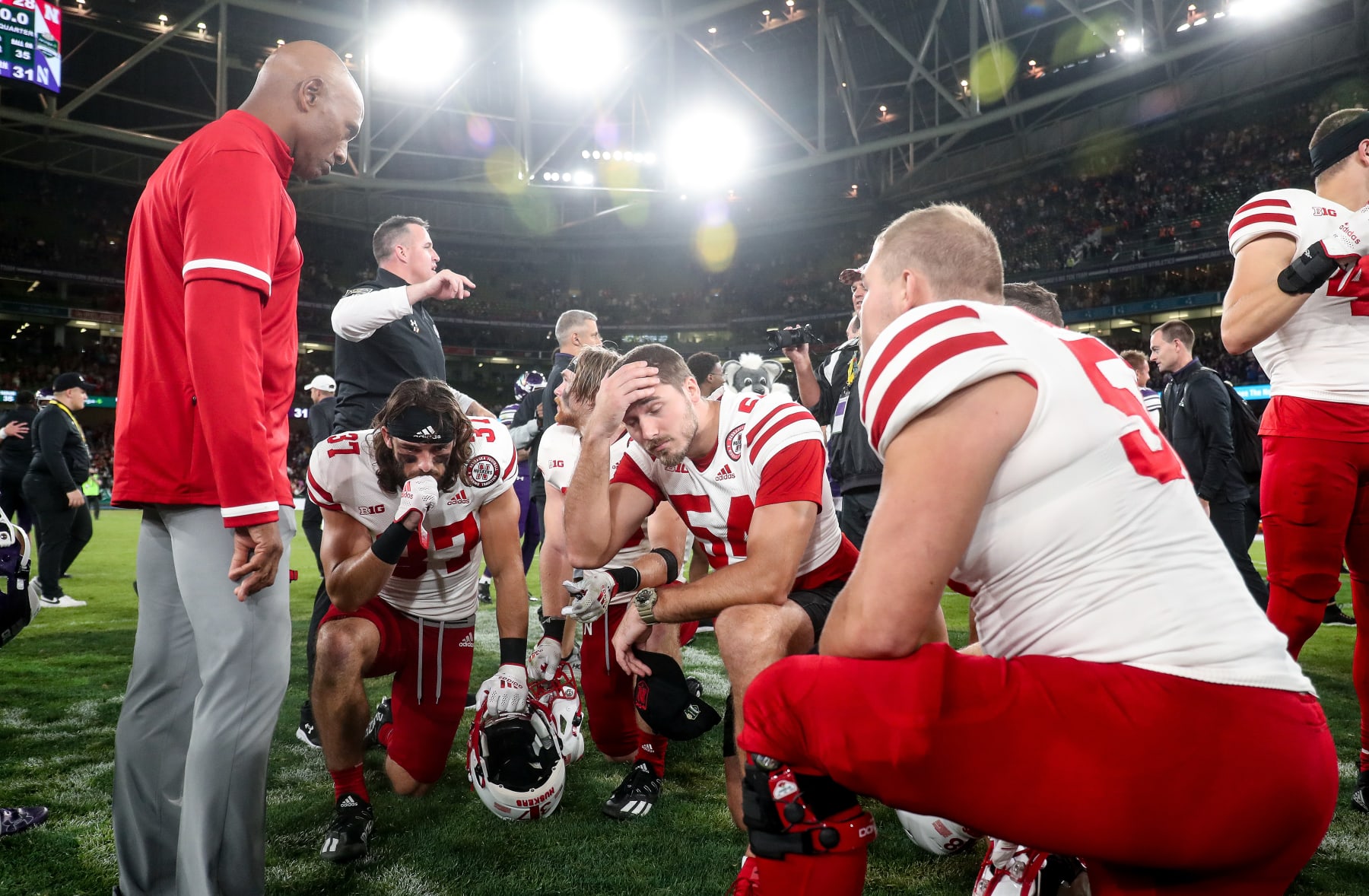 DUBLIN, IRELAND - AUGUST 27: Ron Brown consoles players at full time after the Aer Lingus College Football Classic 2022 match between Northwestern Wildcats and Nebraska Cornhuskersat Aviva Stadium on August 27, 2022 in Dublin, Ireland. (Photo by Oisin Keniry/Getty Images)