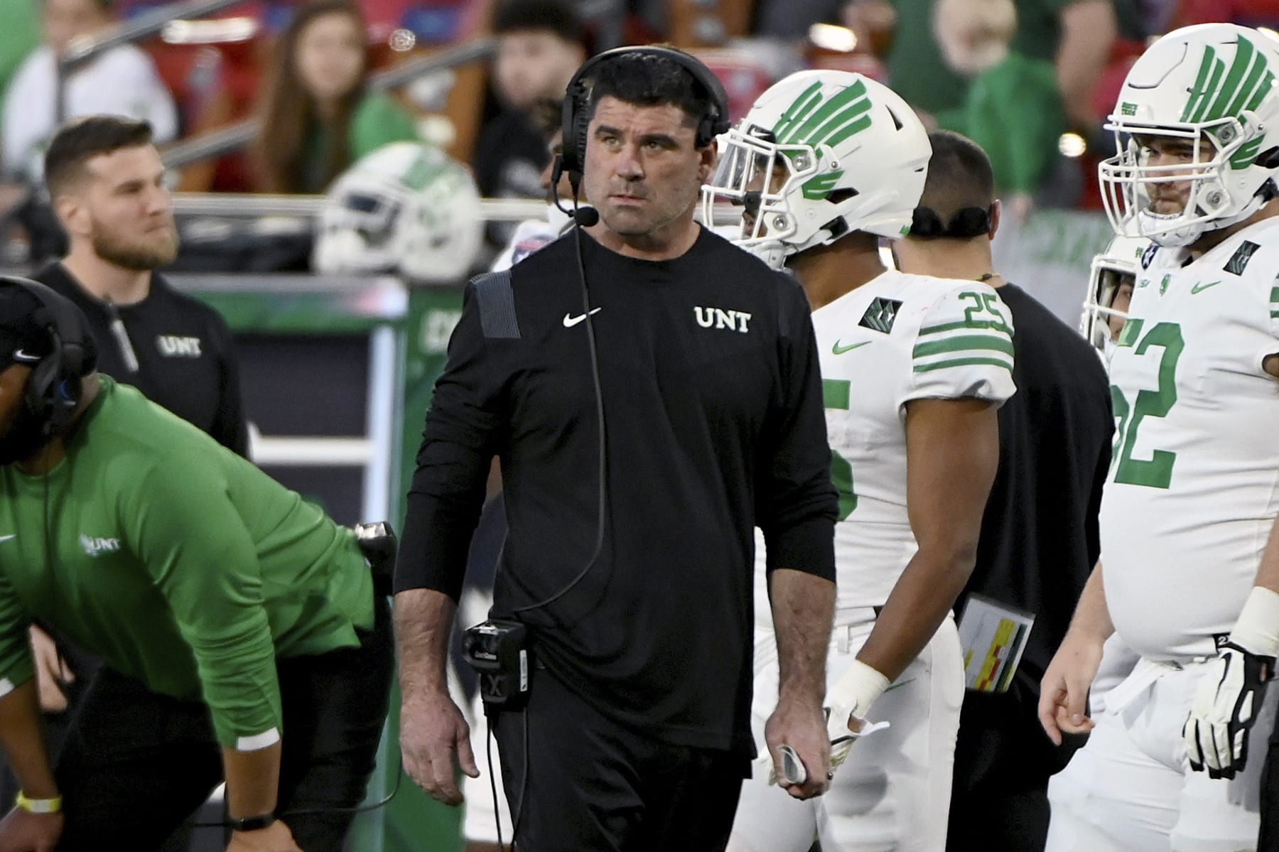 North Texas head coach Seth Littrell walks the sidelines in the first second of the Frisco Football Classic NCAA college football game against Miami (Ohio) in Frisco, Texas, Thursday, Dec. 23, 2021. (AP Photo/Matt Strasen)