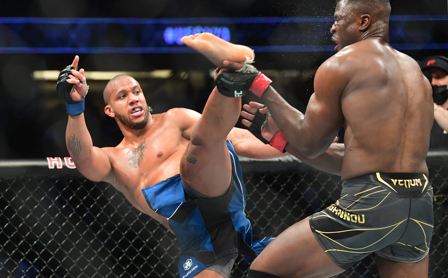 TOPSHOT - France's Ciryl Gane (L) fights reigning champion Francis Ngannou in their UFC 270 championship fight in Anaheim on January 22, 2022. (Photo by Frederic J. BROWN / AFP) (Photo by FREDERIC J. BROWN/AFP via Getty Images)