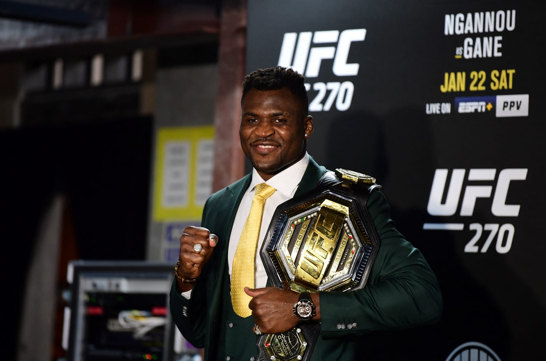 Champion Cameroon's Francis Ngannou holds the championship belt in the press room after defeating French Cyril Gane in their UFC 270 championship fight in Anaheim on January 22, 2022. (Photo by Frederic J. BROWN / AFP) (Photo by FREDERIC J. BROWN/AFP via Getty Images)