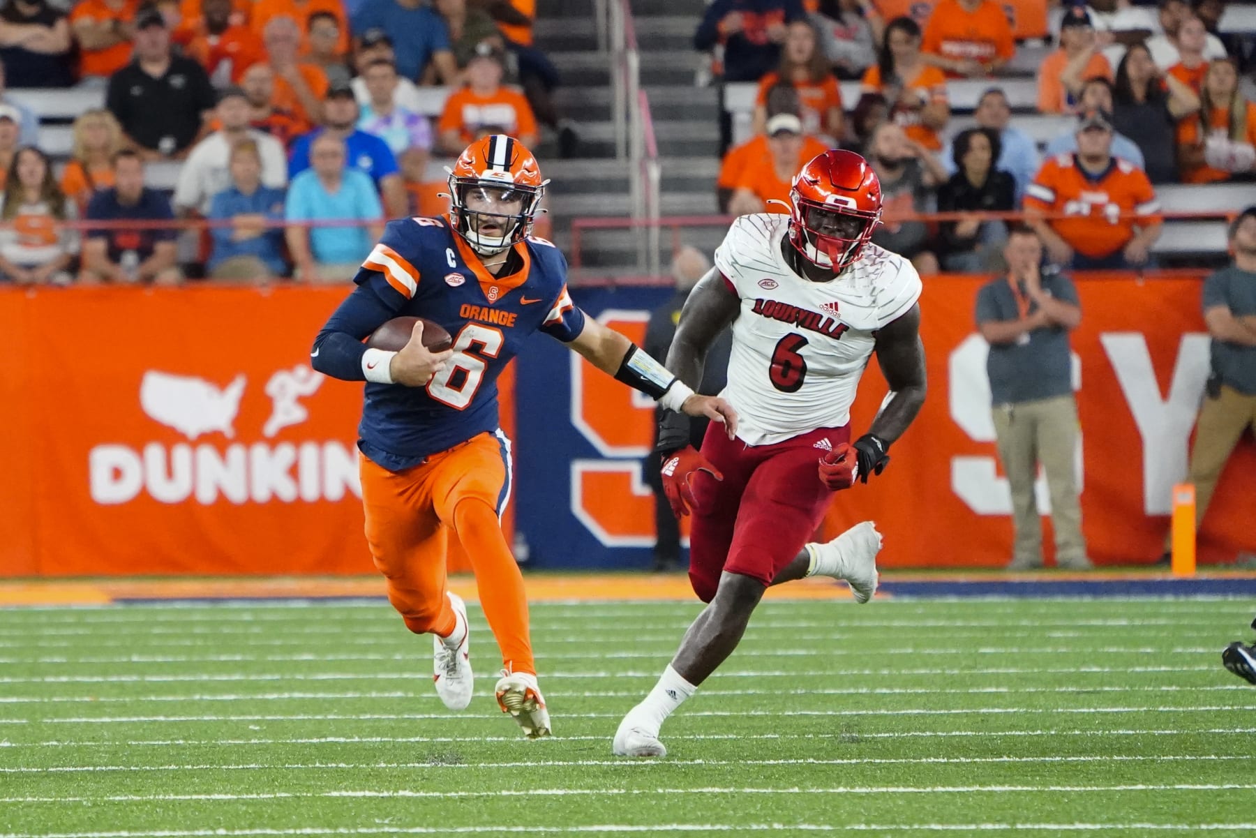 SYRACUSE, NY - SEPTEMBER 03: Syracuse Orange Quarterback Garrett Shrader (6) runs with the ball with Louisville Cardinals Defensive Lineman YaYa Diaby (6) in pursuit during the first half of the college football game between the Louisville Cardinals and the Syracuse Orange on September 3, 2022, at the JMA Wireless Dome in Syracuse, New York. (Photo by Gregory Fisher/Icon Sportswire via Getty Images)