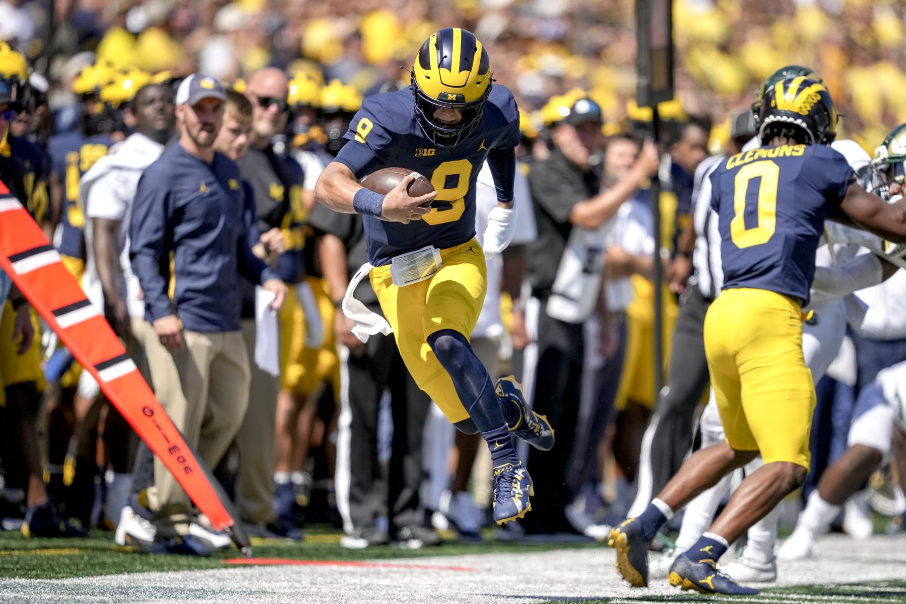 ANN ARBOR, MICHIGAN - SEPTEMBER 03: J.J. McCarthy #9 of the Michigan Wolverines is forced out of bounds against the Colorado State Rams during the second half at Michigan Stadium on September 03, 2022 in Ann Arbor, Michigan. (Photo by Nic Antaya/Getty Images)