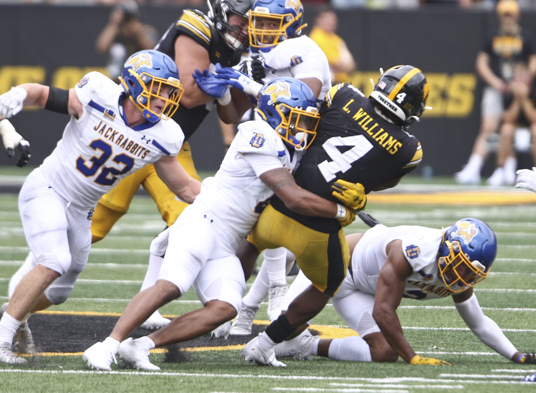 IOWA CITY, IOWA- SEPTEMBER 03:  Running back Leshon Williams #4 of the Iowa Hawkeyes is brought down during the second half by linebacker Isaiah Stalbird #2 ofthe South Dakota State Jackrabbits at Kinnick Stadium on September 03, 2022 in Iowa City, Iowa.  (Photo by Matthew Holst/Getty Images)