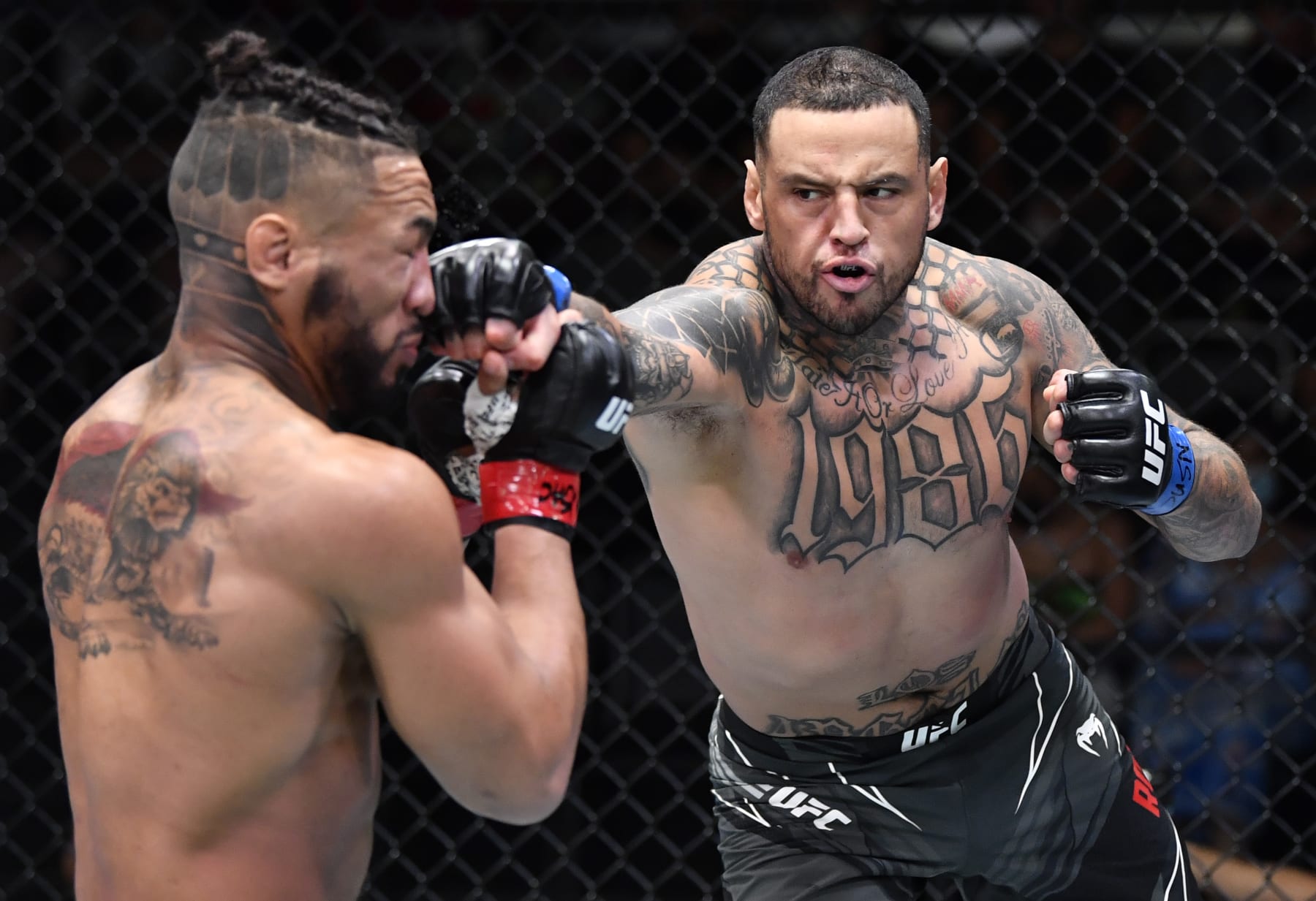 LAS VEGAS, NEVADA - AUGUST 28: (R-L) Daniel Rodriguez punches Kevin Lee in a welterweight fight during the UFC Fight Night event at UFC APEX on August 28, 2021 in Las Vegas, Nevada. (Photo by Chris Unger/Zuffa LLC)