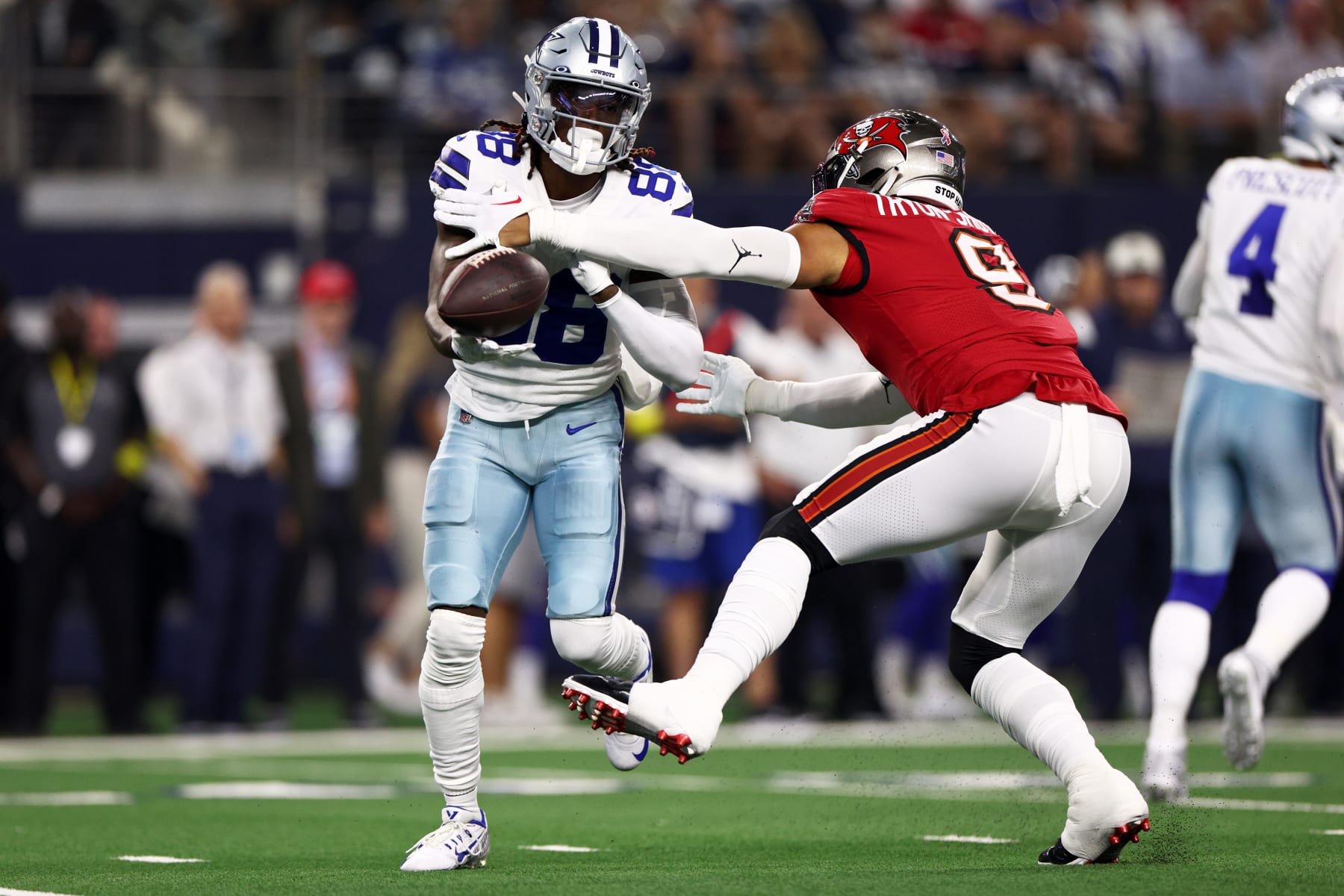 ARLINGTON, TX - SEPTEMBER 11: Dallas Cowboys Quarterback Dak Prescott (4)  looks to throw the ball downfield during the Tampa Bay Buccaneers-Dallas  Cowboys regular season game on September 11, 2022 at AT&T