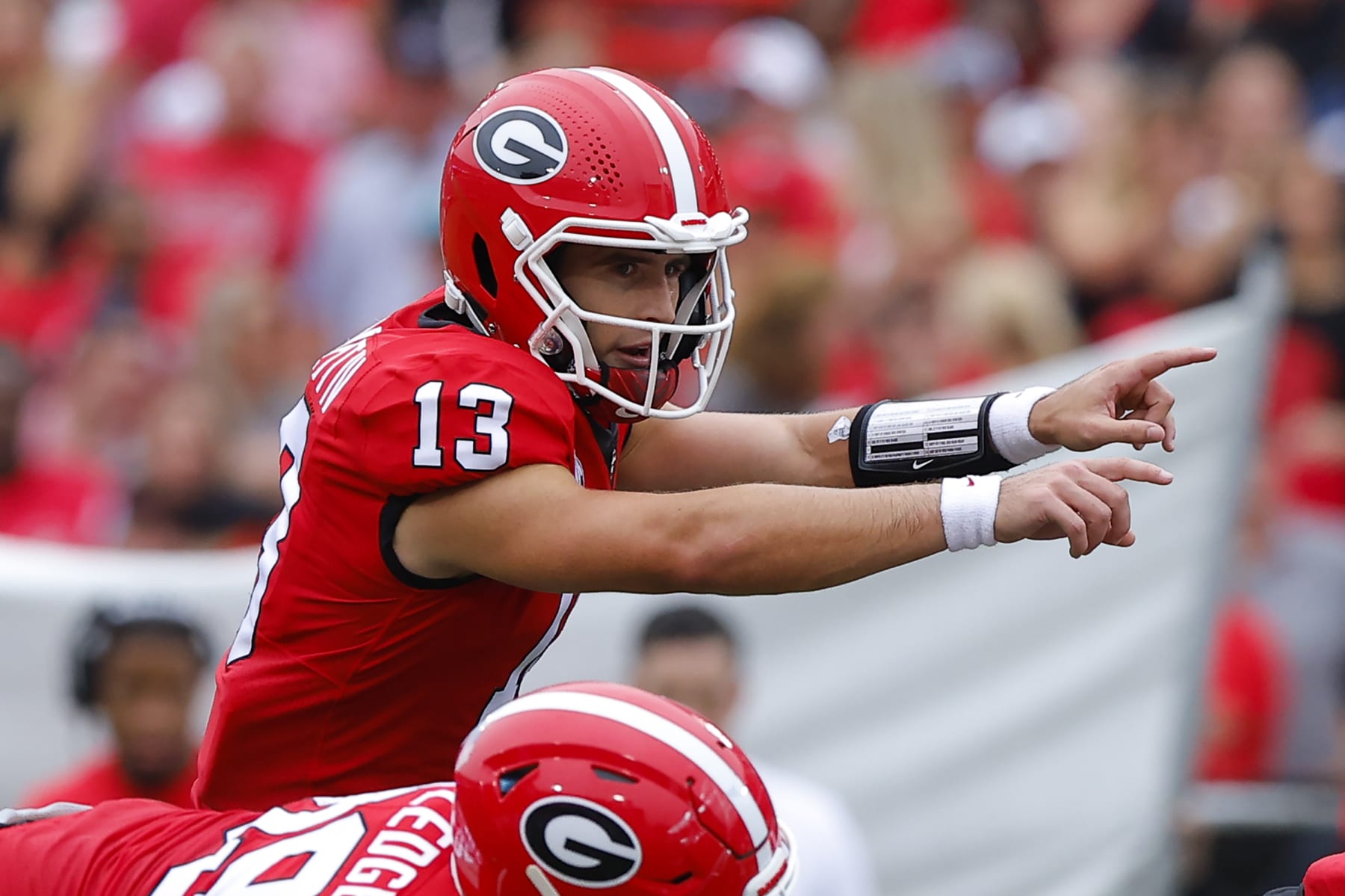 ATHENS, GA - SEPTEMBER 10: Stetson Bennett #13 of the Georgia Bulldogs calls out a formation in the first half against the Samford Bulldogs at Sanford Stadium on September 10, 2022 in Atlanta, Georgia. (Photo by Todd Kirkland/Getty Images)