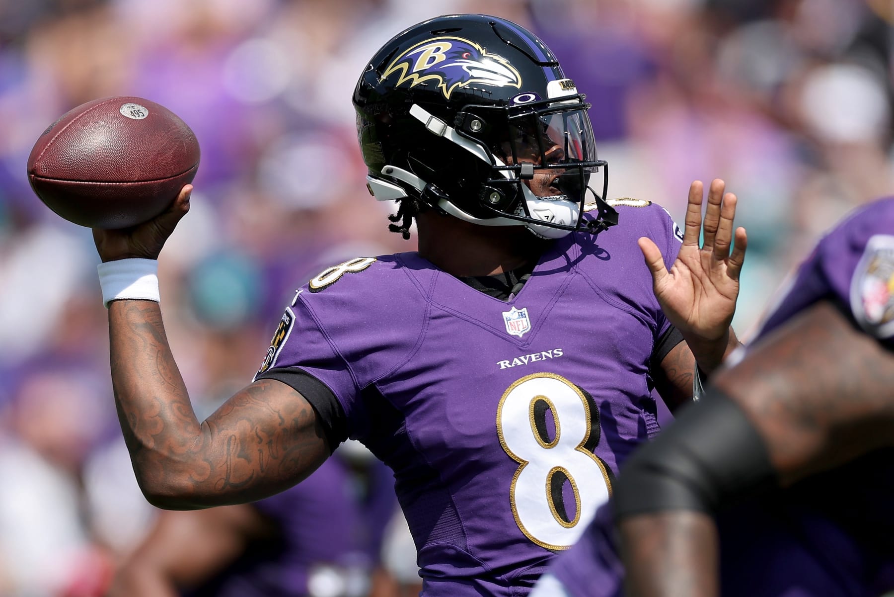 BALTIMORE, MARYLAND - SEPTEMBER 18: Lamar Jackson #8 of the Baltimore Ravens throws a pass in the first quarter against the Miami Dolphins at M&T Bank Stadium on September 18, 2022 in Baltimore, Maryland. (Photo by Patrick Smith/Getty Images)