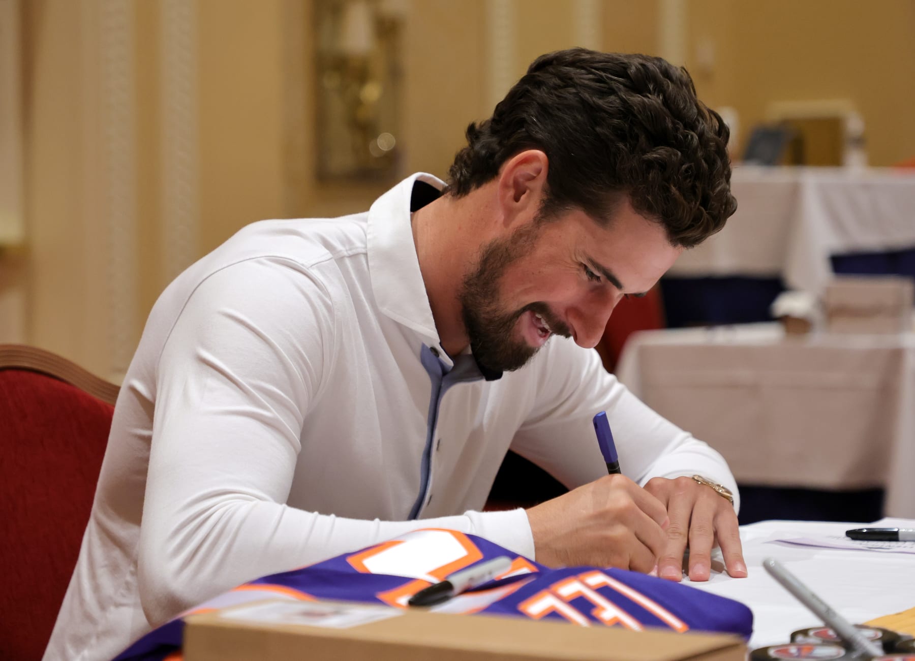 LAS VEGAS, NEVADA - SEPTEMBER 15: Dylan Larkin of the Detroit Red Wings signs autographs during the 2022 NHL player media tour at Encore Las Vegas on September 15, 2022 in Las Vegas, Nevada. (Photo by Ethan Miller/Getty Images)