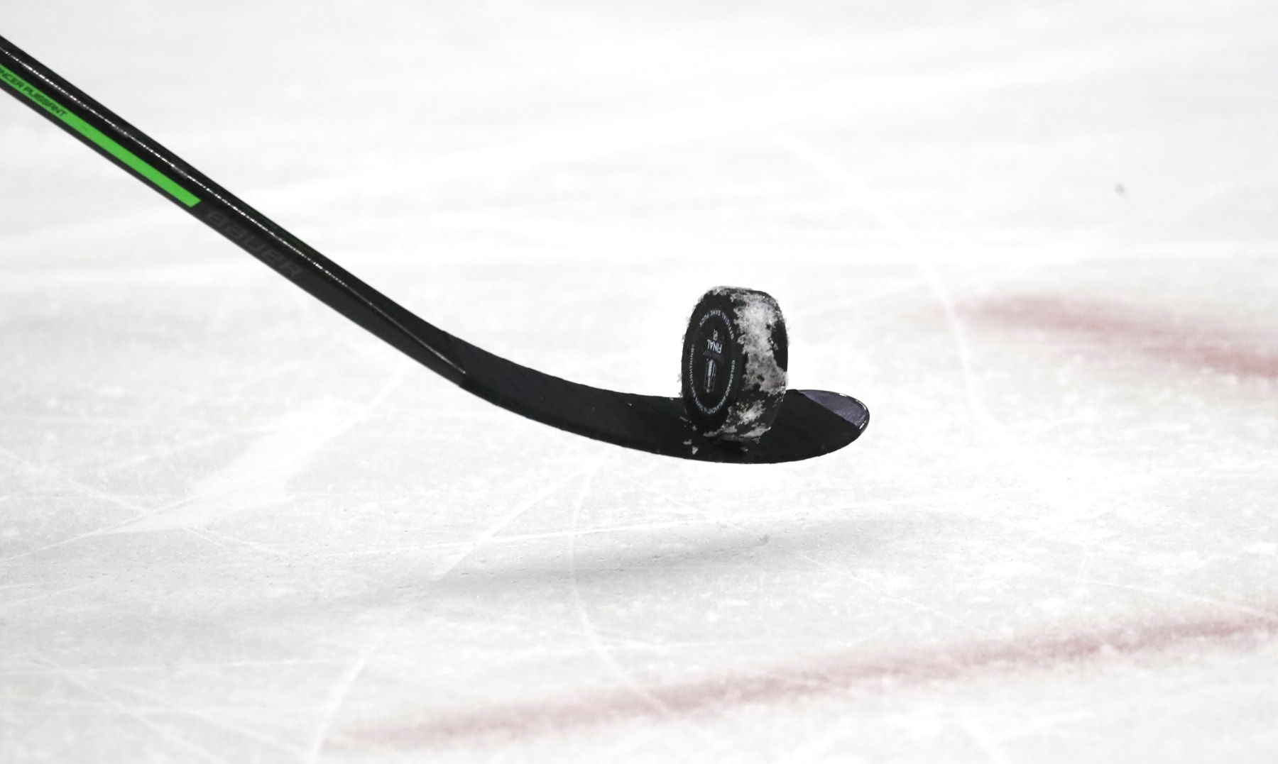 DENVER, COLORADO - JUNE 24: A general view of a stick and puck is seen during the second period of Game Five of the 2022 Stanley Cup Final between the Tampa Bay Lightning and the Colorado Avalanche at Ball Arena on June 24, 2022 in Denver. (Photo by Eliot J. Schechter/NHLI via Getty Images)