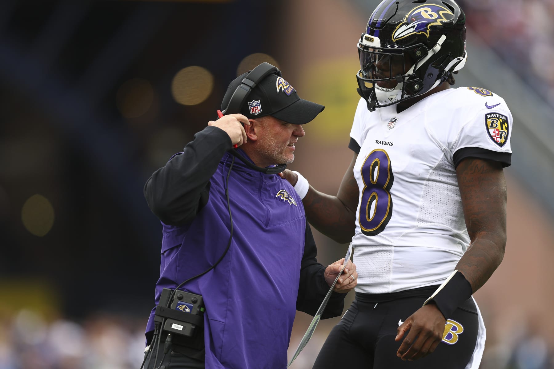 FOXBOROUGH, MASSACHUSETTS - SEPTEMBER 25: Lamar Jackson #8 of the Baltimore Ravens speaks with head coach John Harbaugh during the game against the New England Patriots at Gillette Stadium on September 25, 2022 in Foxborough, Massachusetts. (Photo by Adam Glanzman/Getty Images) FOXBOROUGH, MASSACHUSETTS - SEPTEMBER 25: Lamar Jackson #8 of the Baltimore Ravens speaks with head coach John Harbaugh during the game against the New England Patriots at Gillette Stadium on September 25, 2022 in Foxborough, Massachusetts. (Photo by Adam Glanzman/Getty Images)