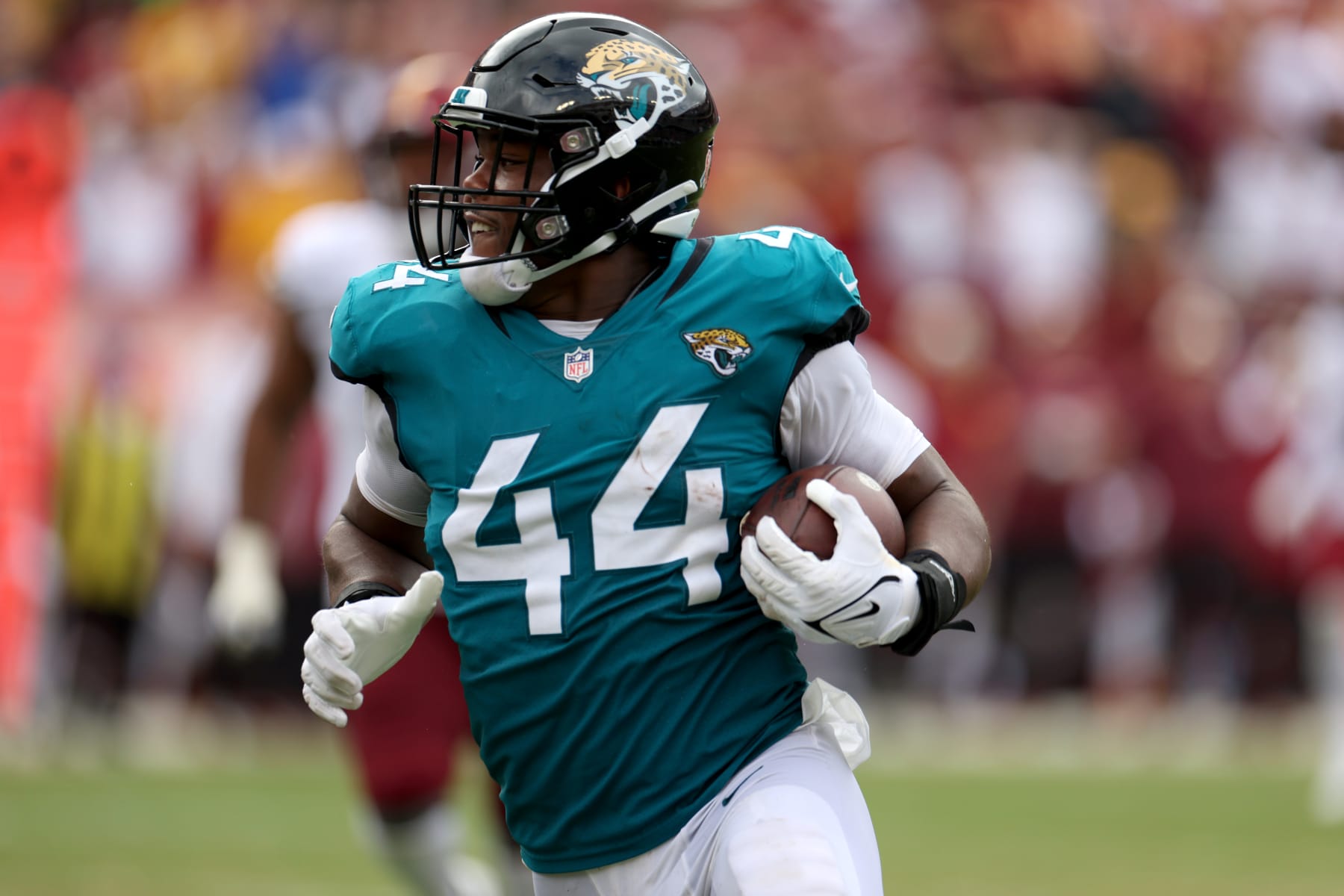 LANDOVER, MARYLAND - SEPTEMBER 11: Linebacker Travon Walker #44 of the Jacksonville Jaguars returns an interception against the Washington Commanders at FedExField on September 11, 2022 in Landover, Maryland. (Photo by Rob Carr/Getty Images)