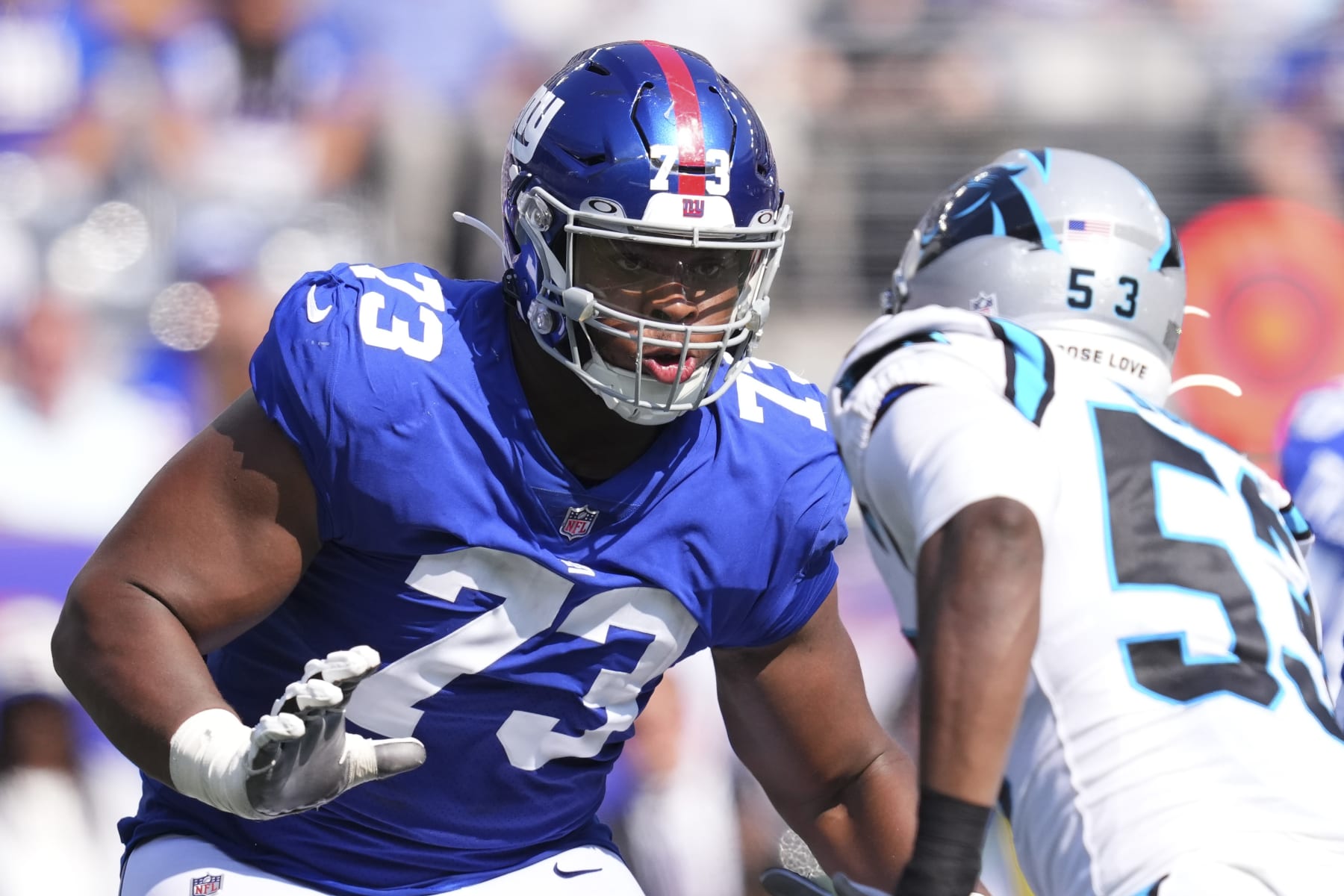 EAST RUTHERFORD, NJ - SEPTEMBER 18: Evan Neal #73 of the New York Giants blocks Brian Burns #53 of the Carolina Panthers at MetLife Stadium on September 18, 2022 in East Rutherford, New Jersey. (Photo by Mitchell Leff/Getty Images)