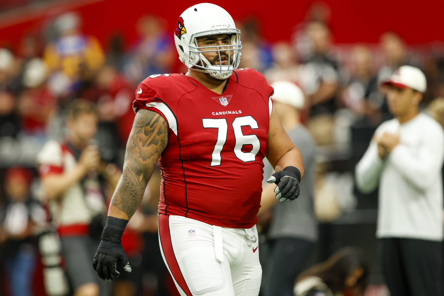 Arizona Cardinals guard Will Hernandez (76) wears a Mexico flag