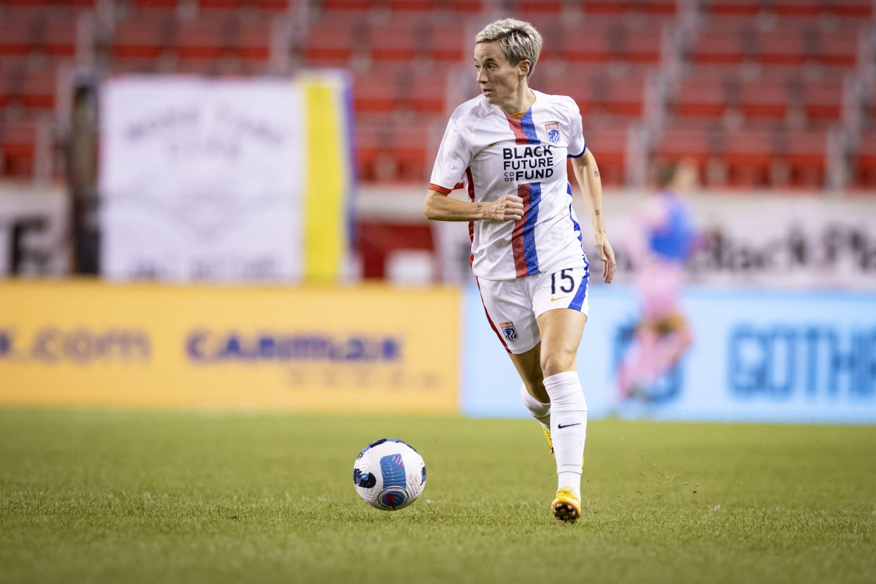 HARRISON, NJ - SEPTEMBER 21: Megan Rapinoe #15 of OL Reign takes he ball down the pitch in the second half of the National Womens Soccer League match against NJ/NY Gotham FC at Red Bull Arena on September 21, 2022 in Harrison, New Jersey. (Photo by Ira L. Black - Corbis/Getty Images)