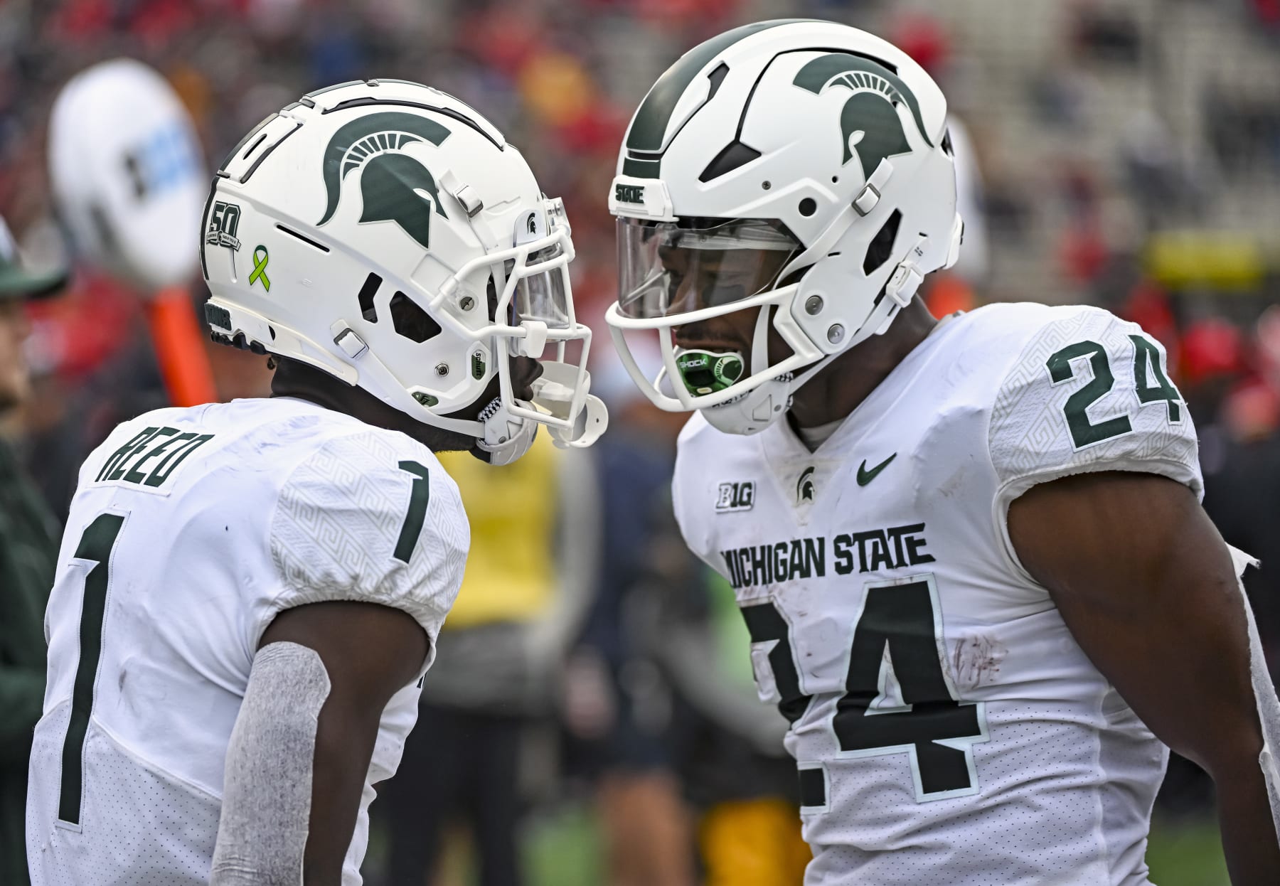 COLLEGE PARK, MD - OCTOBER 01: Michigan State Spartans wide receiver Jayden Reed (1) celebrated his touchdown reception with running back Elijah Collins (24) during the Michigan State Spartans game versus the Maryland Terrapins on October 1, 2022 at SECU Stadium in College Park, MD. (Photo by Mark Goldman/Icon Sportswire via Getty Images)