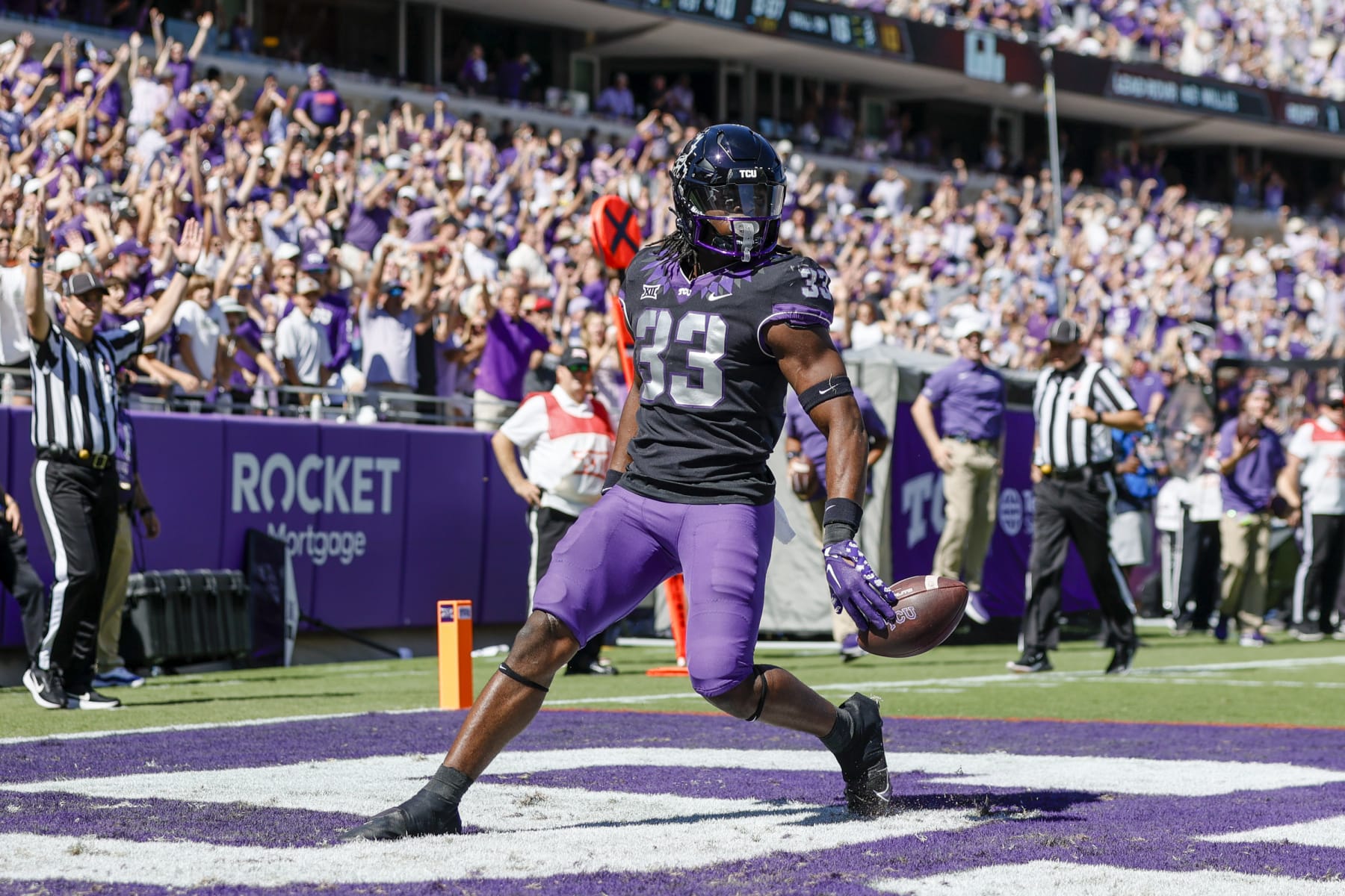FORT WORTH, TX - OCTOBER 01: TCU Horned Frogs running back Kendre Miller (33) crosses the goal line scoring a touchdown during the game between the TCU Horned Frogs and the Oklahoma Sooners on October 1, 2022 at Amon G. Carter Stadium in Fort Worth, Texas. (Photo by Matthew Pearce/Icon Sportswire via Getty Images)