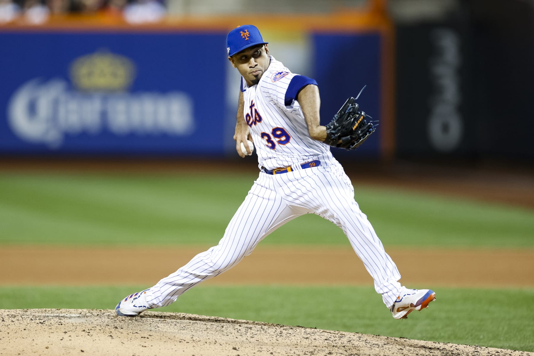 NEW YORK, NEW YORK - OCTOBER 08: Edwin Diaz #39 of the New York Mets delivers during the seventh inning against the San Diego Padres in game two of the Wild Card Series at Citi Field on October 08, 2022 in New York City. (Photo by Sarah Stier/Getty Images)