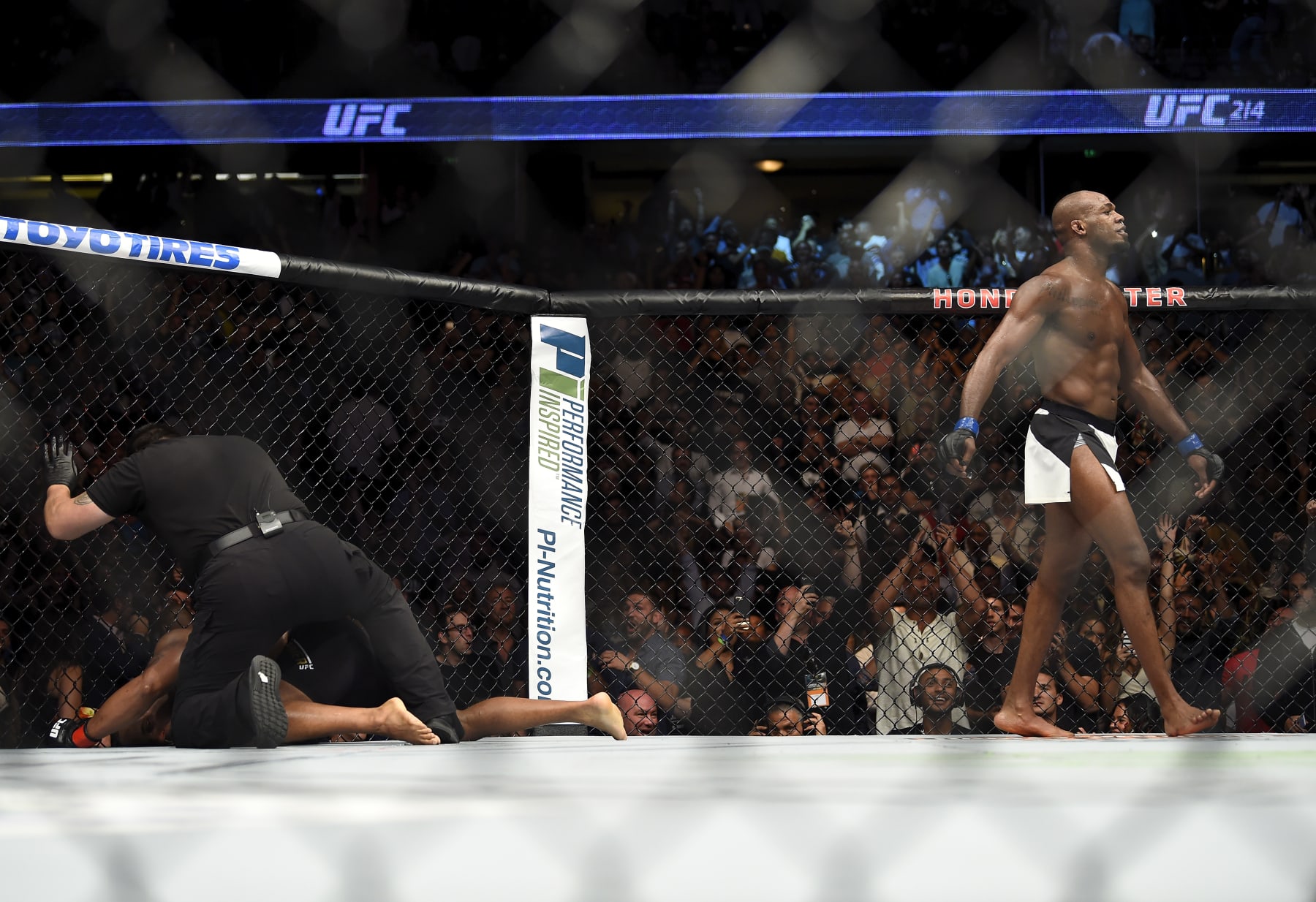 ANAHEIM, CA - JULY 29: (R-L) Jon Jones celebrates after defeating Daniel Cormier in their UFC light heavyweight championship bout during the UFC 214 event inside the Honda Center on July 29, 2017 in Anaheim, California. (Photo by Jeff Bottari/Zuffa LLC/Zuffa LLC via Getty Images)
