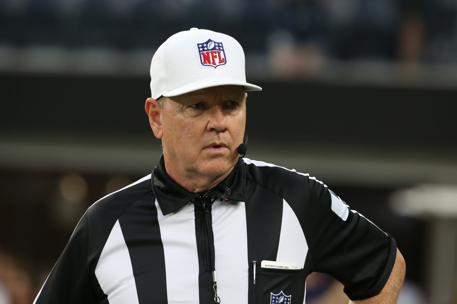 NFL referees discuss a penalty flag thrown during the second half of an NFL  playoff game betwee …