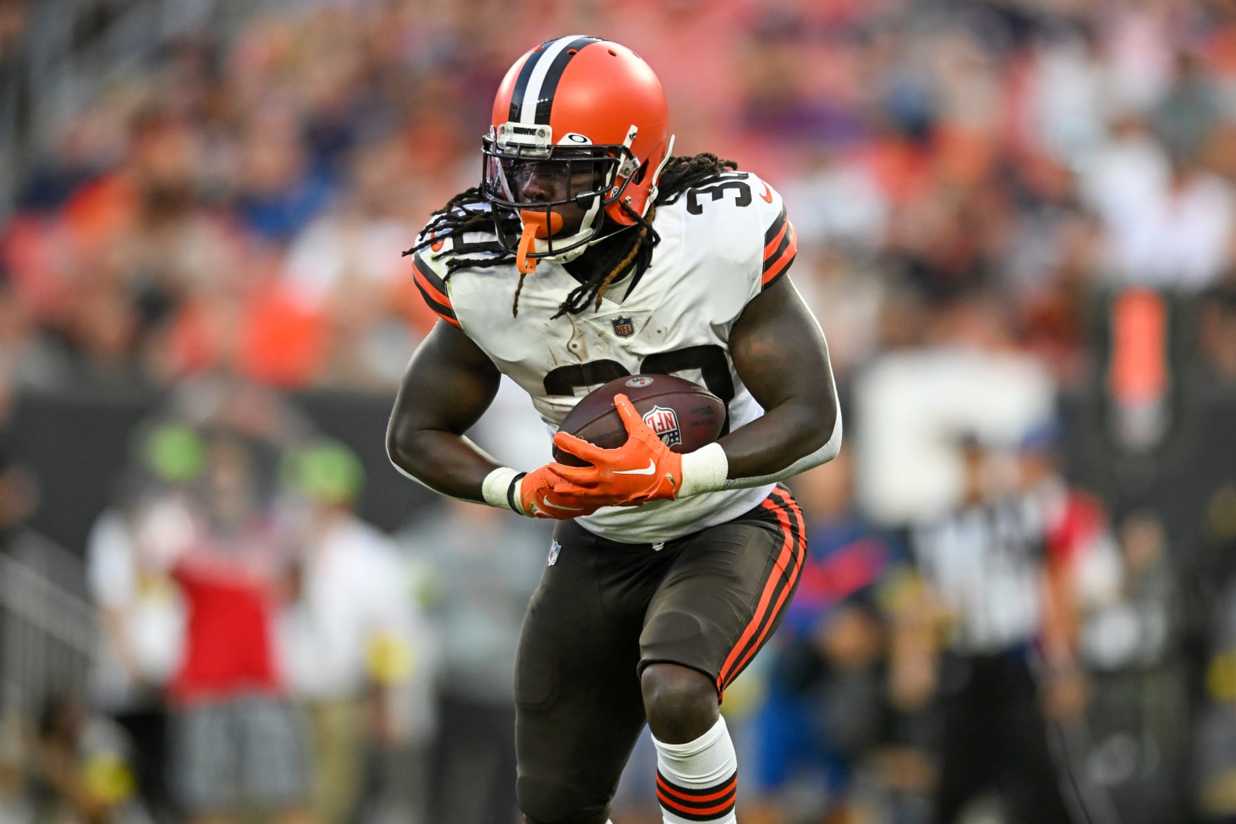 Cleveland Browns D'Ernest Johnson runs behind a block from Justin