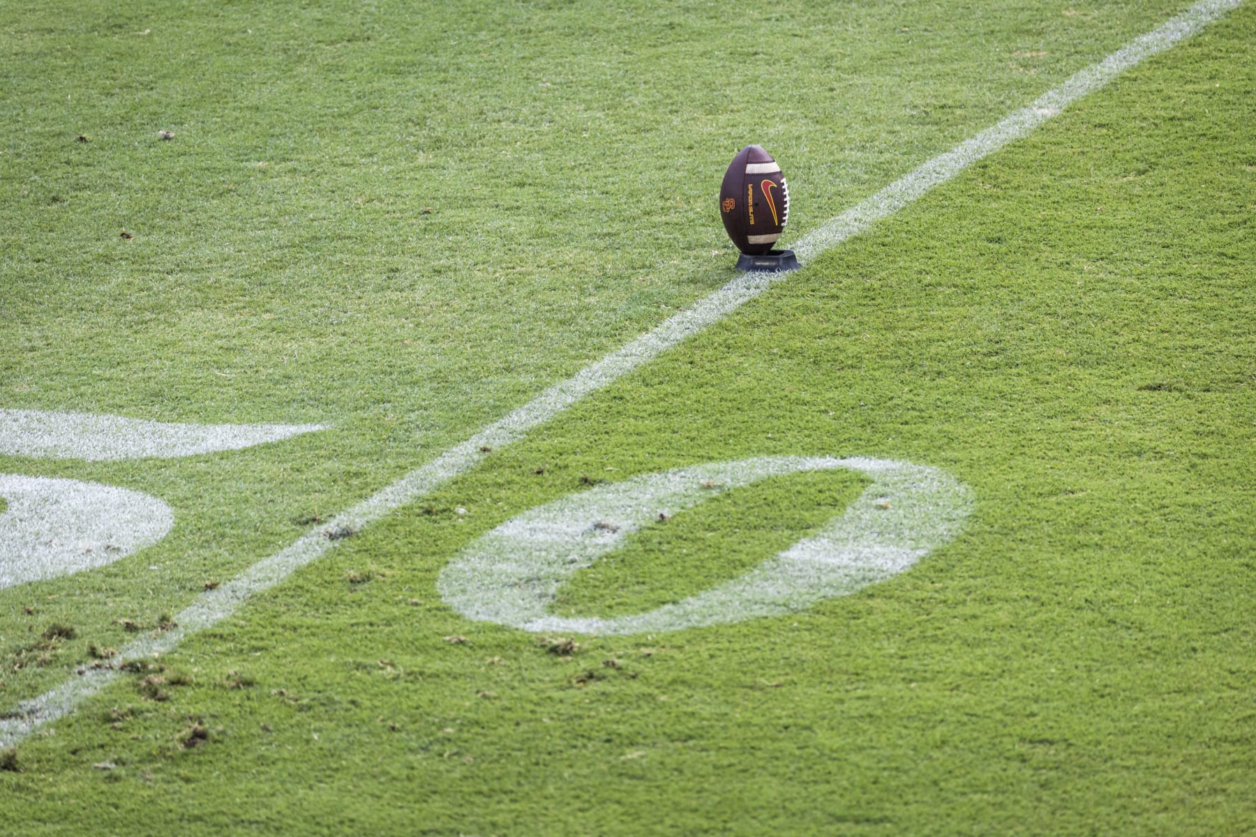 PALO ALTO, CA - SEPTEMBER 10: A football sits on a kicking tee before a Pac-12 college football game between the USC Trojans and the Stanford Cardinal played on September 10, 2022 at Stanford Stadium in Palo Alto, California. (Photo by David Madison/Getty Images)