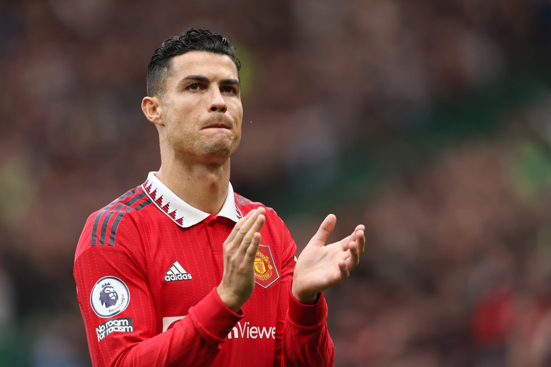 Cristiano Ronaldo of Manchester United walks back to the centre