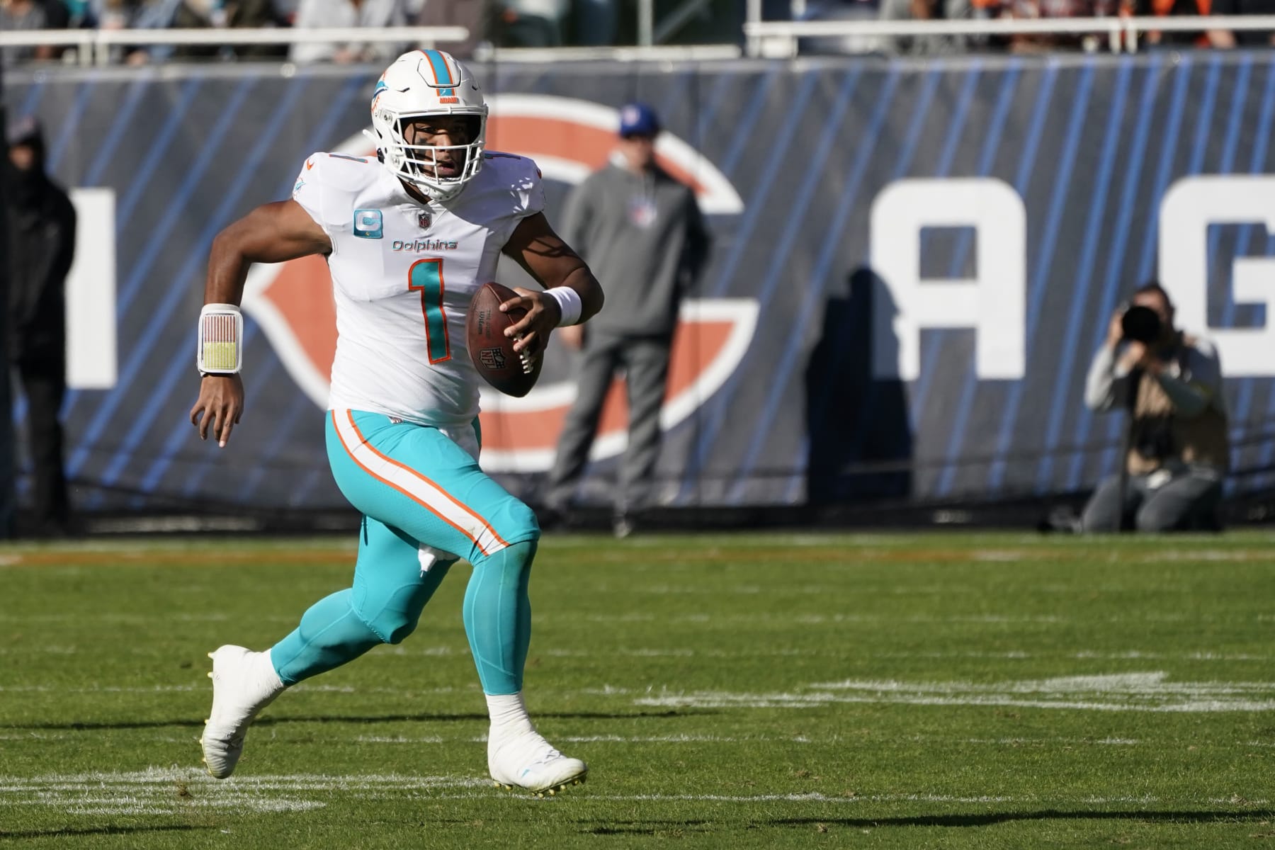 Miami Dolphins head coach Mike McDaniel greets quarterback Tua Tagovailoa  as players warm up before the start of an NFL football game against the Chicago  Bears, Sunday, Nov. 6, 2022 in Chicago. (