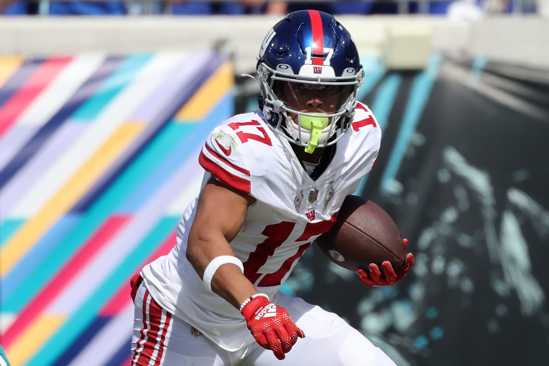 Minnesota Vikings wide receiver Justin Jefferson (18) makes an incredible  catch in front of Buffalo Bills safety Cam Lewis (39) during the second  half of an NFL football game in Orchard Park