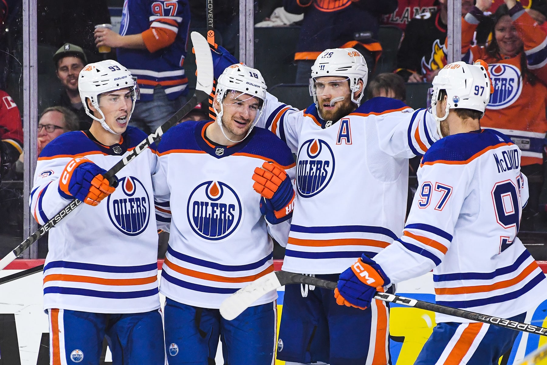 CALGARY, CANADA - OCTOBER 29: (L to R) Ryan Nugent-Hopkins #93, Zach Hyman #18, Leon Draisaitl #29 and Connor McDavid #97 of the Edmonton Oilers celebrate after Hyman scored against the Calgary Flames during the second period of an NHL game at Scotiabank Saddledome on October 29, 2022 in Calgary, Alberta, Canada. (Photo by Derek Leung/Getty Images)
