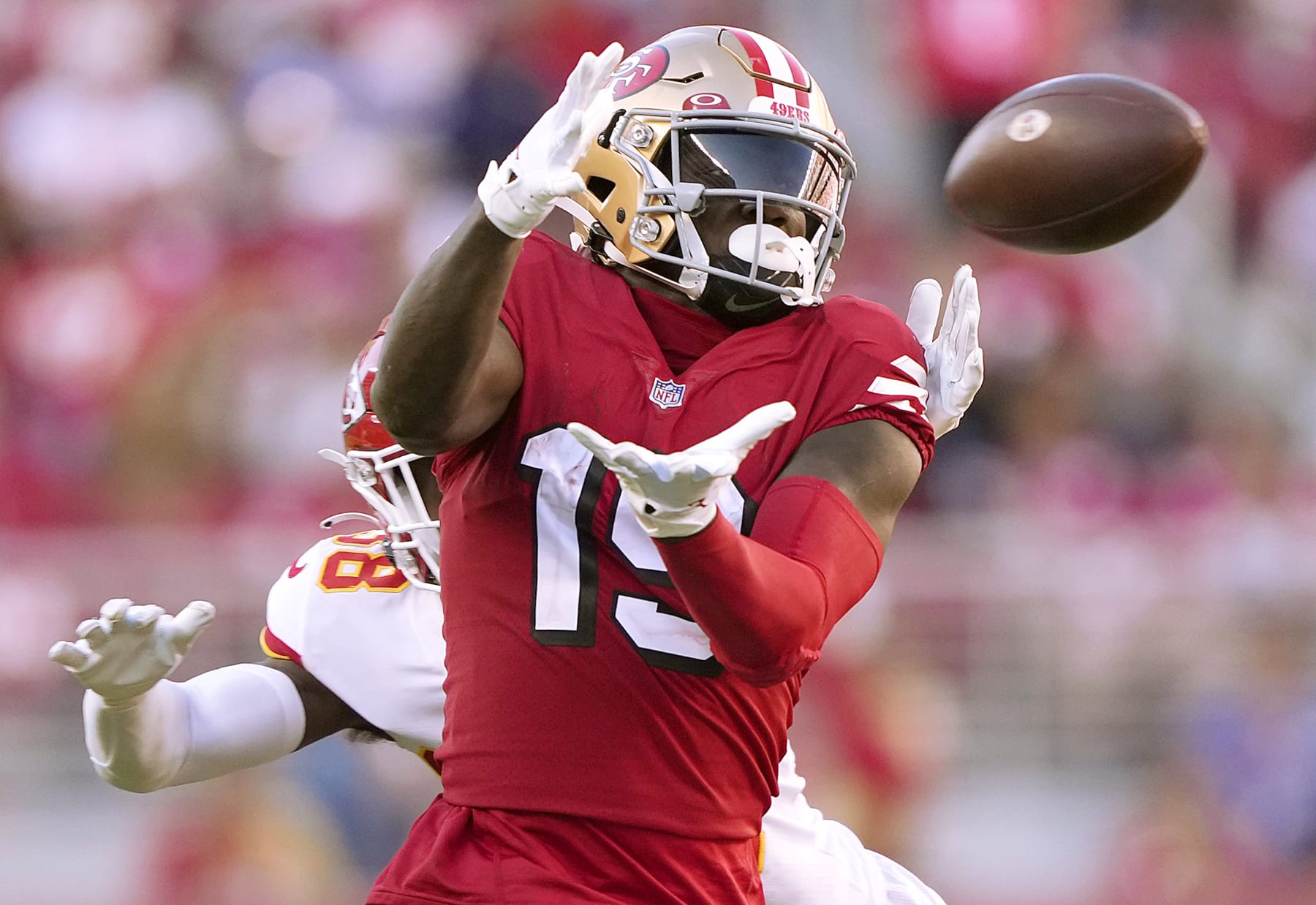 SANTA CLARA, CALIFORNIA - OCTOBER 23: Deebo Samuel #19 of the San Francisco 49ers catches a pass in the fourth quarter against L'Jarius Sneed #38 of the Kansas City Chiefs at Levi's Stadium on October 23, 2022 in Santa Clara, California. (Photo by Thearon W. Henderson/Getty Images)