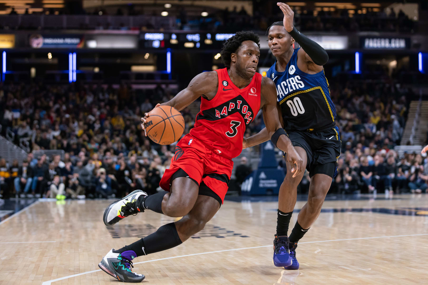 INDIANAPOLIS, IN - NOVEMBER 12: O.G. Anunoby #3 of the Toronto Raptors dribbles against Bennedict Mathurin #00 of the Indiana Pacers at Gainbridge Fieldhouse on November 12, 2022 in Indianapolis, Indiana. NOTE TO USER: User expressly acknowledges and agrees that, by downloading and or using this photograph, User is consenting to the terms and conditions of the Getty Images License Agreement. (Photo by Michael Hickey/Getty Images)
