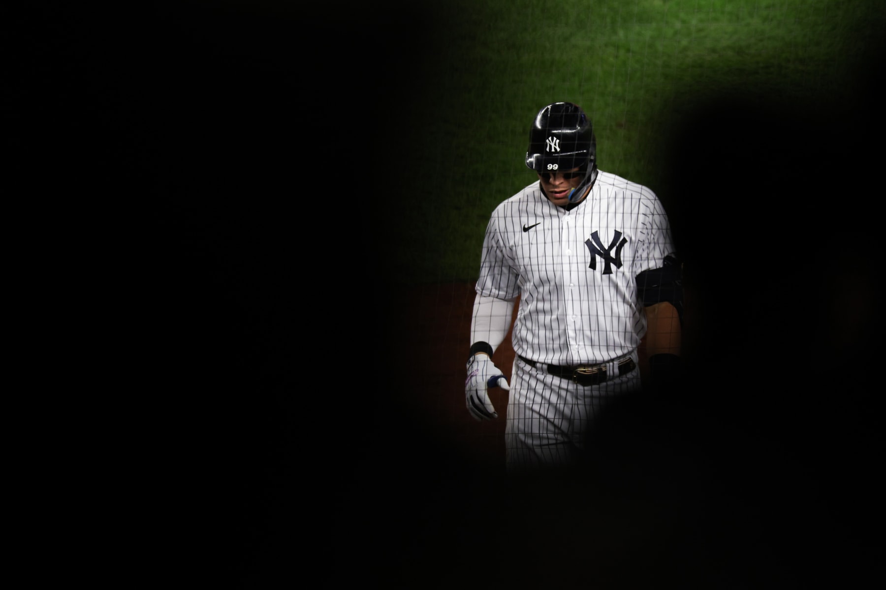 NEW YORK, NEW YORK - OCTOBER 23: Aaron Judge #99 of the New York Yankees walks back to the dugout after a fly out in the first inning in game four of the American League Championship Series against the Houston Astros at Yankee Stadium on October 23, 2022 in the Bronx borough of New York City. (Photo by Jamie Squire/Getty Images)