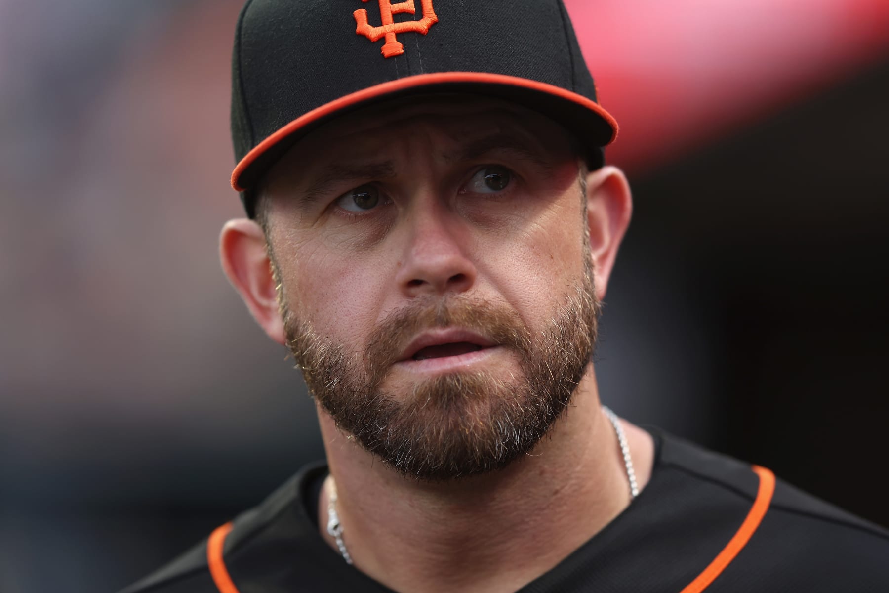SAN FRANCISCO, CALIFORNIA - SEPTEMBER 17: Evan Longoria #10 of the San Francisco Giants looks on from the dugout before the game against the Los Angeles Dodgers at Oracle Park on September 17, 2022 in San Francisco, California. (Photo by Lachlan Cunningham/Getty Images)