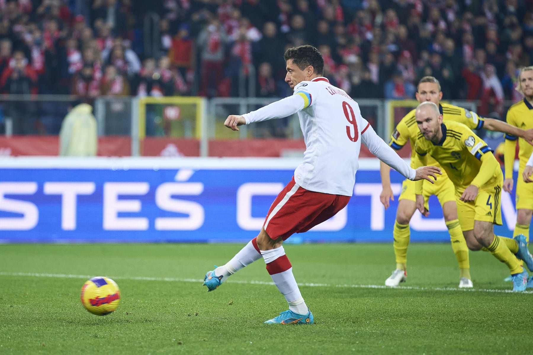 CHORZOW, POLAND - MARCH 29: Robert Lewandowski from Poland shoots goal from penalty kick during the 2022 FIFA World Cup Qualifier knockout round play-off match between Poland and Sweden at Silesian Stadium on March 29, 2022 in Chorzow. (Photo by Adam Nurkiewicz/Getty Images)