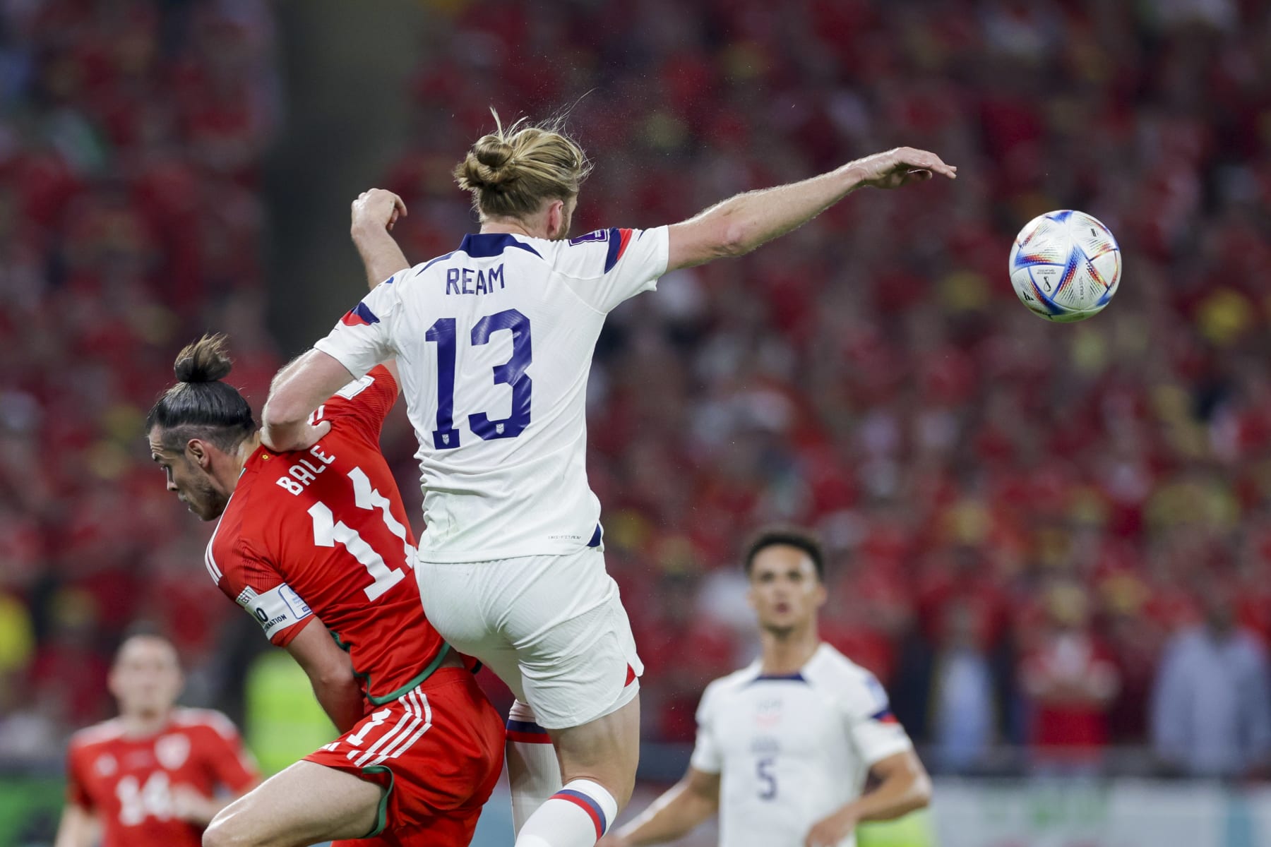 DOHA, QATAR - NOVEMBER 21: Gareth Bale of Wales and Tim Ream of USA battle for the ball during the FIFA World Cup Qatar 2022 Group B match between USA and Wales at Ahmad Bin Ali Stadium on November 21, 2022 in Doha, Qatar. (Photo by Mohammad Karamali/DeFodi Images via Getty Images)