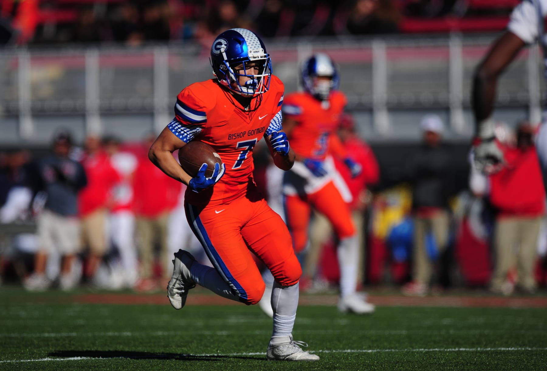 LAS VEGAS, NV - DECEMBER 03: Bishop Gorman running back Biaggio Ali Walsh (7)  rushes for a touchdown against the Liberty Patriots in the first half of the NIAA class 4A championship game on December 03, 2016, at Sam Boyd Stadium in Las Vegas, NV. Ali Walsh has committed to Cal and is the grandson of the late boxer Muhammad Ali. Gorman defeated Liberty 84-8.