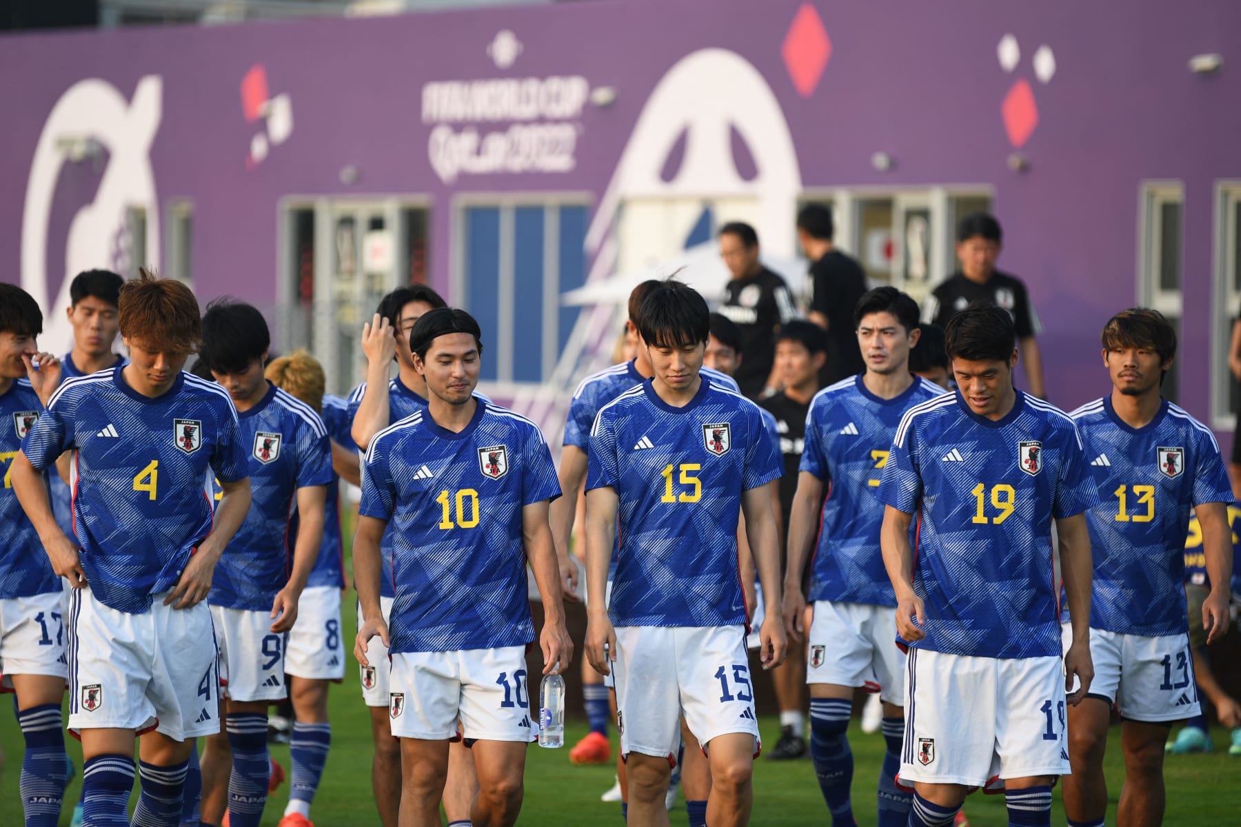 (From L) Japan's defender Kou Itakura, Japan's midfielder Takumi Minamino, Japan's midfielder Daichi Kamada, Japan's defender Hiroki Sakai arrive for a training session at the Al Sadd SC training grounds in Doha on November 19, 2022, ahead of the Qatar 2022 World Cup football tournament. (Photo by Philip FONG / AFP) (Photo by PHILIP FONG/AFP via Getty Images)