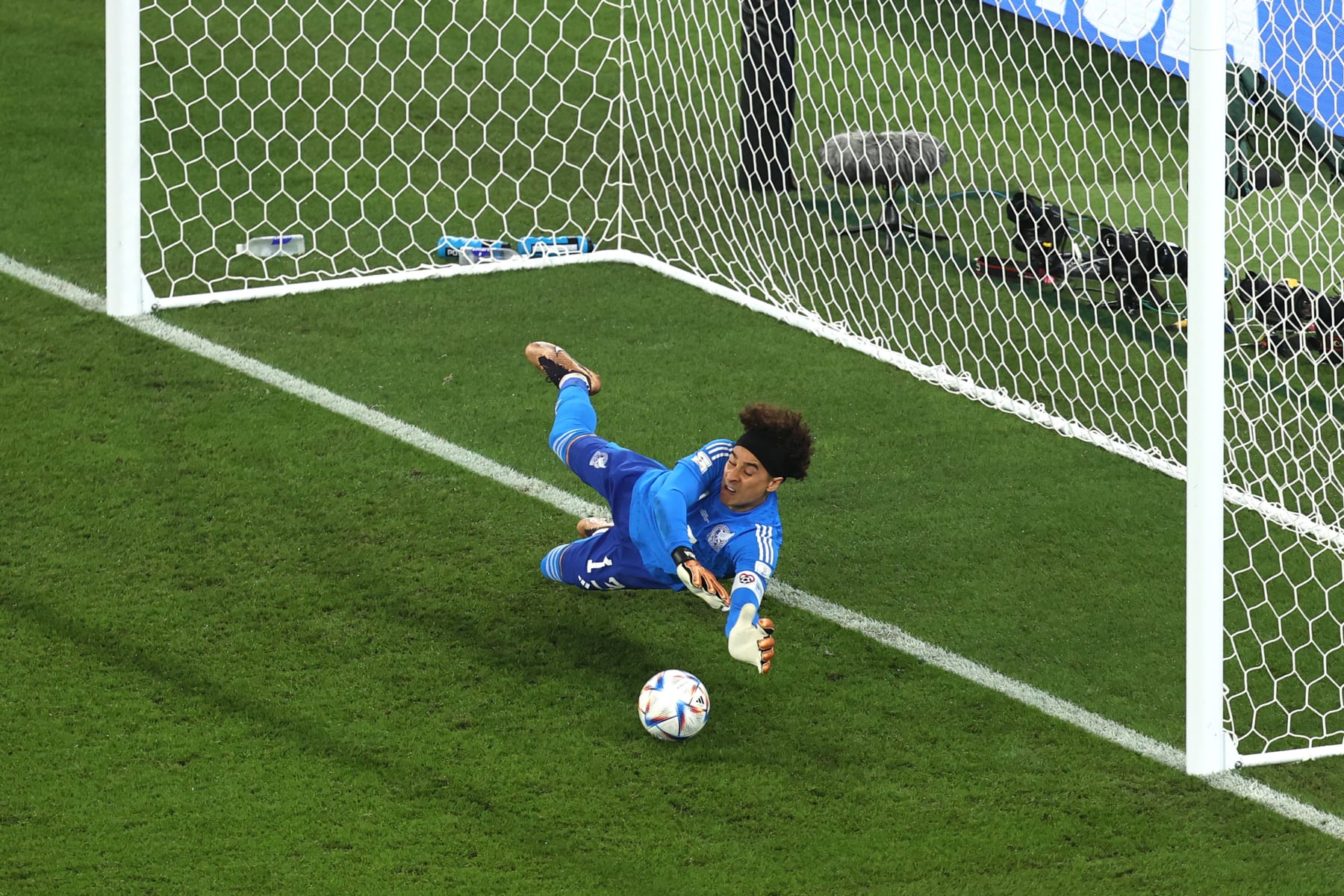DOHA, QATAR - NOVEMBER 22: Mexico goalkeeper Guillermo Ochoa saves a penalty kick from Robert Lewandowski of Poland during the FIFA World Cup Qatar 2022 Group C match between Mexico and Poland at Stadium 974 on November 22, 2022 in Doha, Qatar. (Photo by Charlotte Wilson/Offside/Offside via Getty Images)