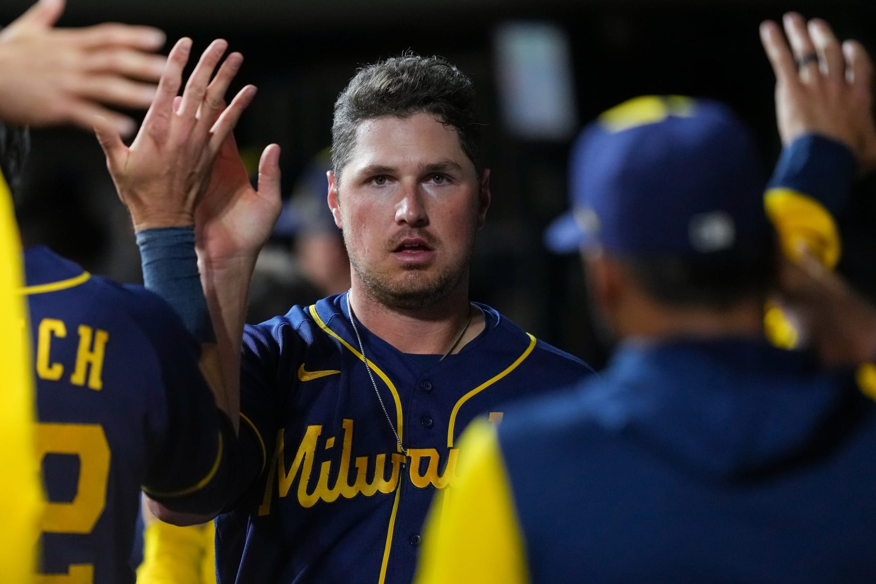 CINCINNATI, OHIO - SEPTEMBER 23: Hunter Renfroe #12 of the Milwaukee Brewers celebrates with teammates after scoring a run in the seventh inning against the Cincinnati Reds at Great American Ball Park on September 23, 2022 in Cincinnati, Ohio. (Photo by Dylan Buell/Getty Images)