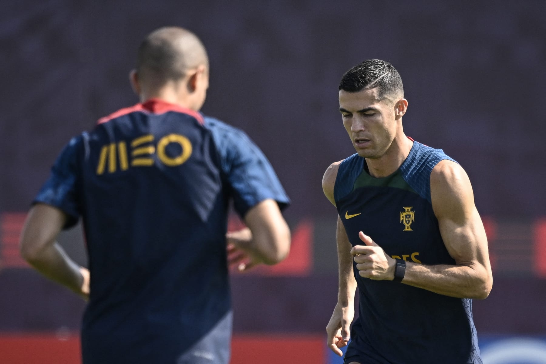 Unknown Portugal's forward Cristiano Ronaldo (R) takes part in a training session at the Al Shahaniya SC training site in Al Samriya, northwest of Doha, on November 22, 2022, during the Qatar 2022 World Cup football tournament. (Photo by PATRICIA DE MELO MOREIRA / AFP) (Photo by PATRICIA DE MELO MOREIRA/AFP via Getty Images)