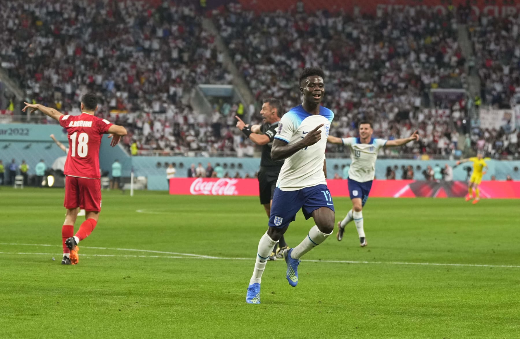 DOHA, QATAR - NOVEMBER 21: Bukayo Saka celebrates scoring his teams second goal during the FIFA World Cup Qatar 2022 Group B match between England and IR Iran at Khalifa International Stadium on November 21, 2022 in Doha, Qatar. (Photo by Ulrik Pedersen/DeFodi Images via Getty Images)