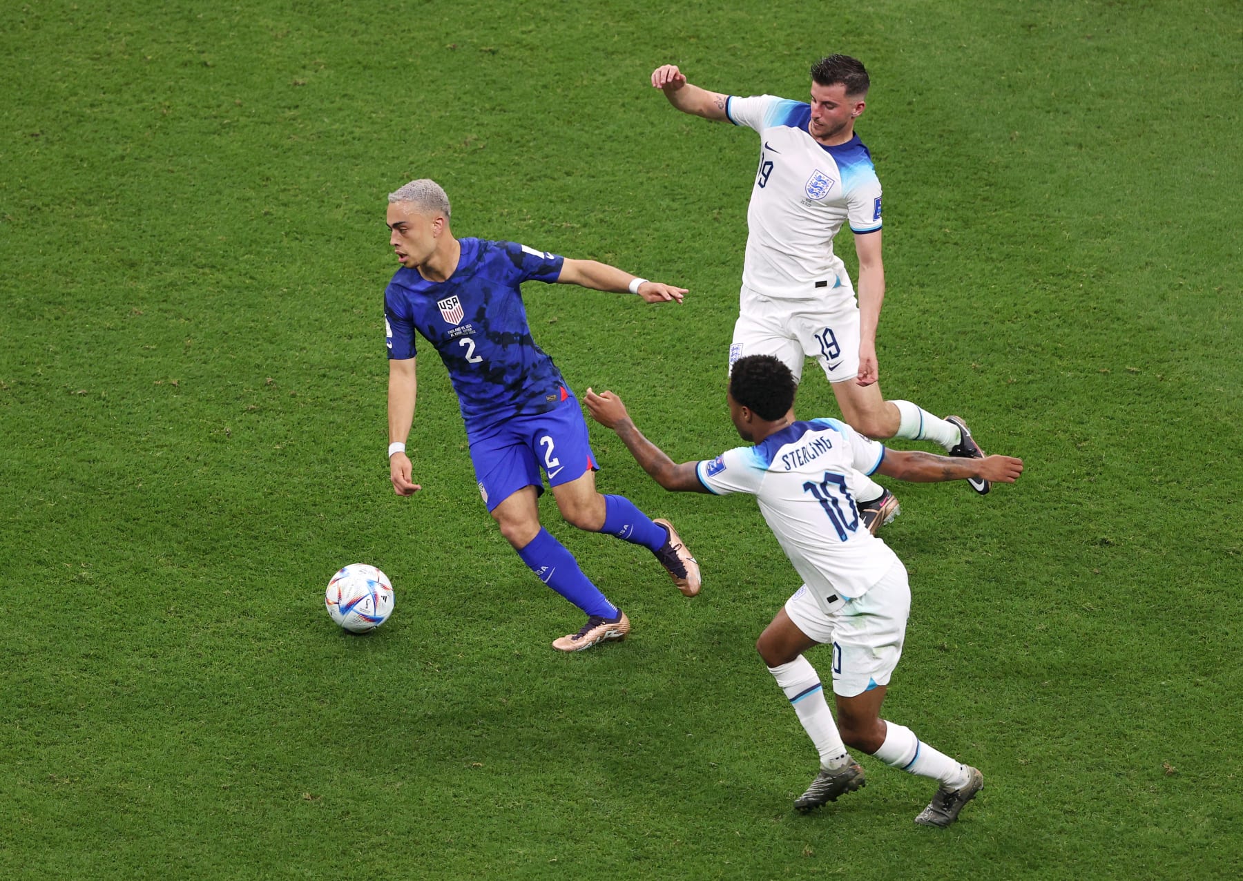 AL KHOR, QATAR - NOVEMBER 25: Sergino Dest of United States controls the ball against Raheem Sterling and Mason Mount of England during the FIFA World Cup Qatar 2022 Group B match between England and USA at Al Bayt Stadium on November 25, 2022 in Al Khor, Qatar. (Photo by Julian Finney/Getty Images)