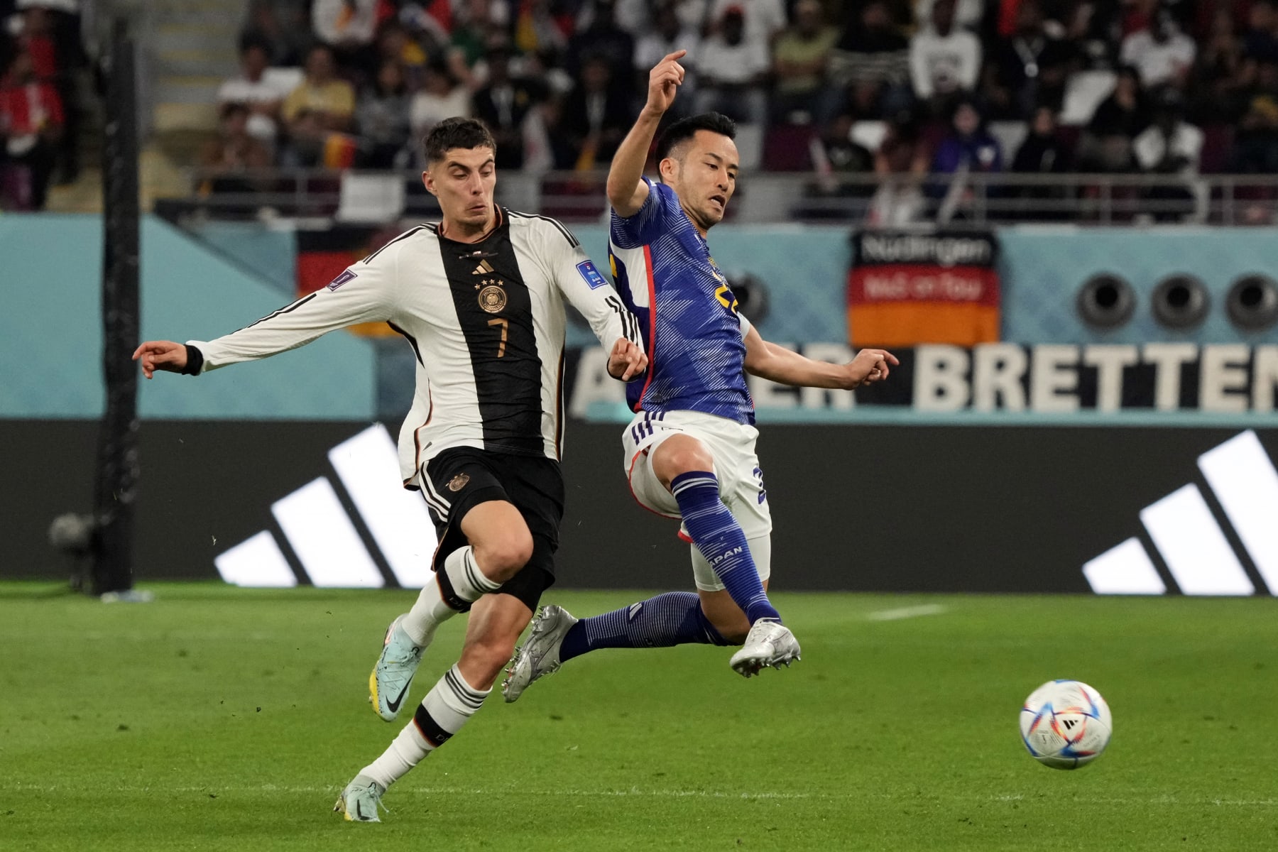 DOHA, QATAR - NOVEMBER 23: Maya Yoshida of Japan and Kai Havertz of Germany in action during the FIFA World Cup Qatar 2022 Group E match between Germany and Japan at Khalifa International Stadium on November 23, 2022 in Doha, Qatar. (Photo by Koji Watanabe/Getty Images)