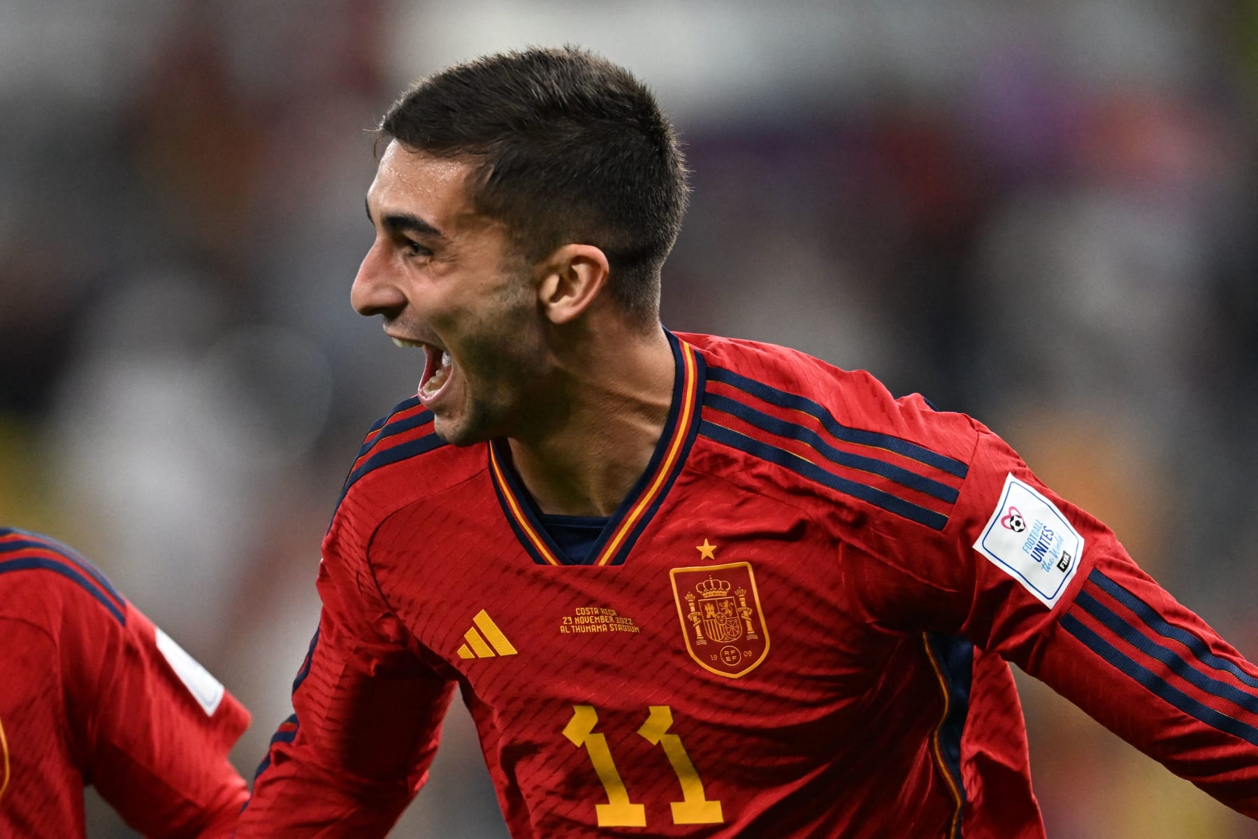 Spain's forward #11 Ferran Torres celebrates after scoring his team's fourth goal during the Qatar 2022 World Cup Group E football match between Spain and Costa Rica at the Al-Thumama Stadium in Doha on November 23, 2022. (Photo by Raul ARBOLEDA / AFP) (Photo by RAUL ARBOLEDA/AFP via Getty Images)
