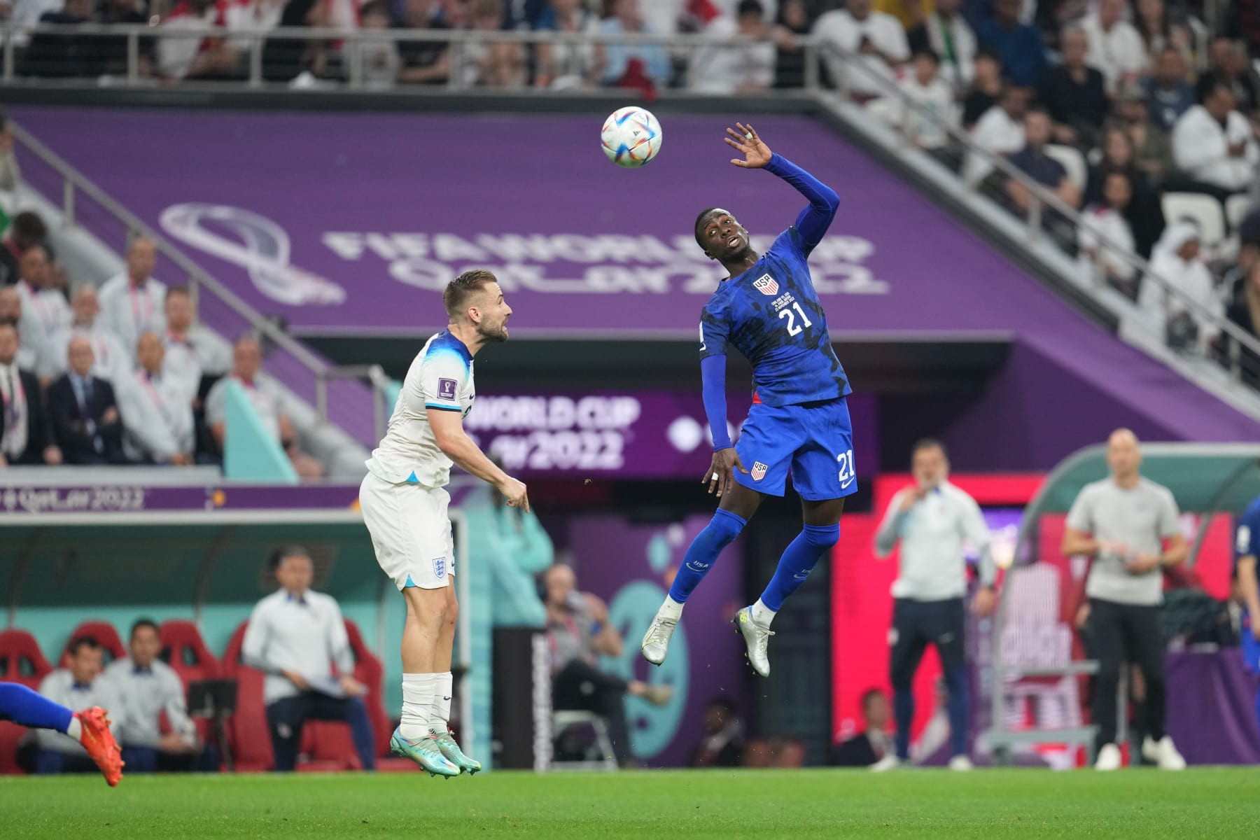 AL KHOR, QATAR - NOVEMBER 25: Tim Weah #21 of the United States goes up for a header during a FIFA World Cup Qatar 2022 Group B match between England and USMNT at Al Bayt Stadium on November 25, 2022 in Al Khor, Qatar. (Photo by Brad Smith/ISI Photos/Getty Images)